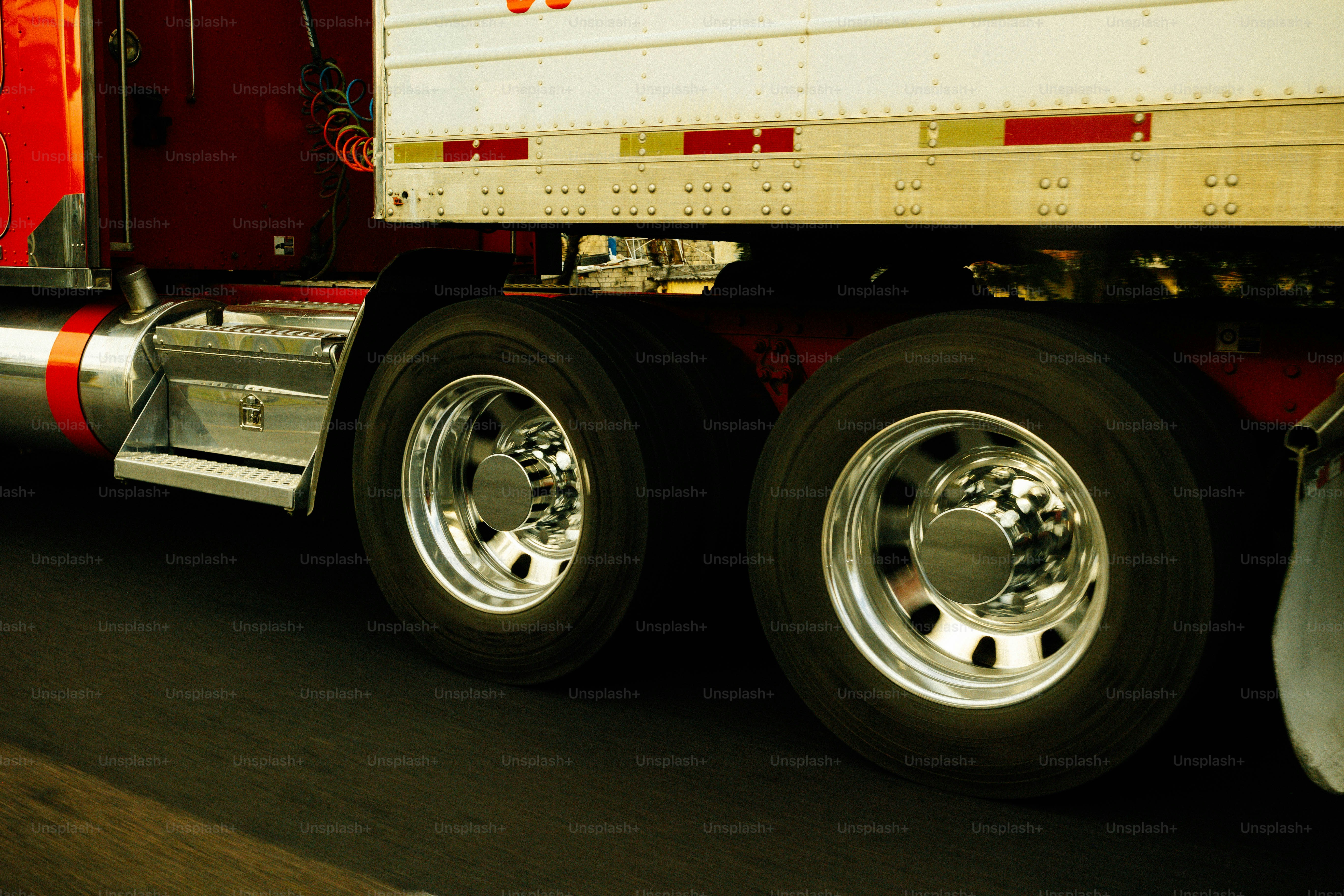 Close-up of a semi-truck's dual wheels on-road wheels