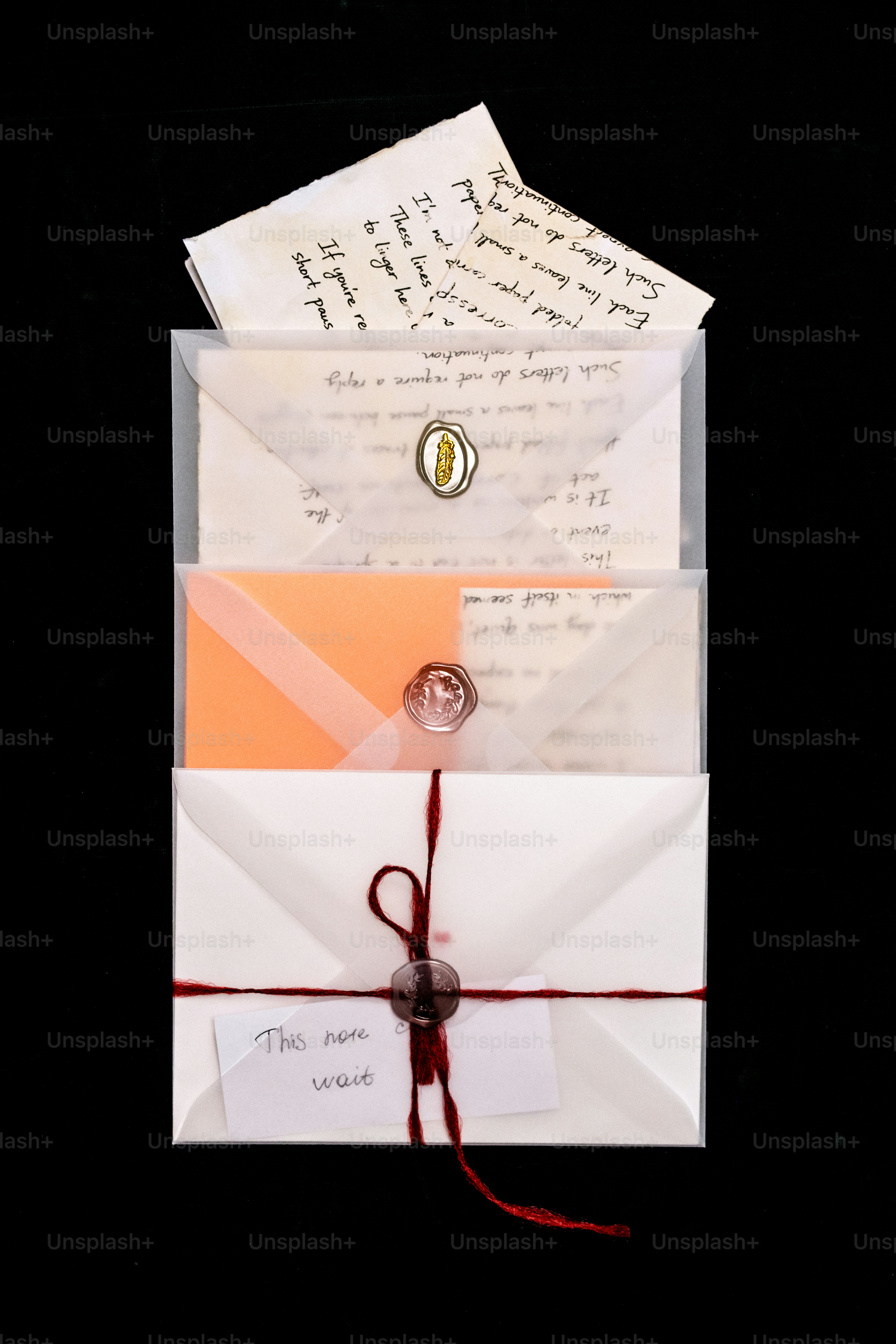 Three colorful envelopes with wax seals on white background photo ...