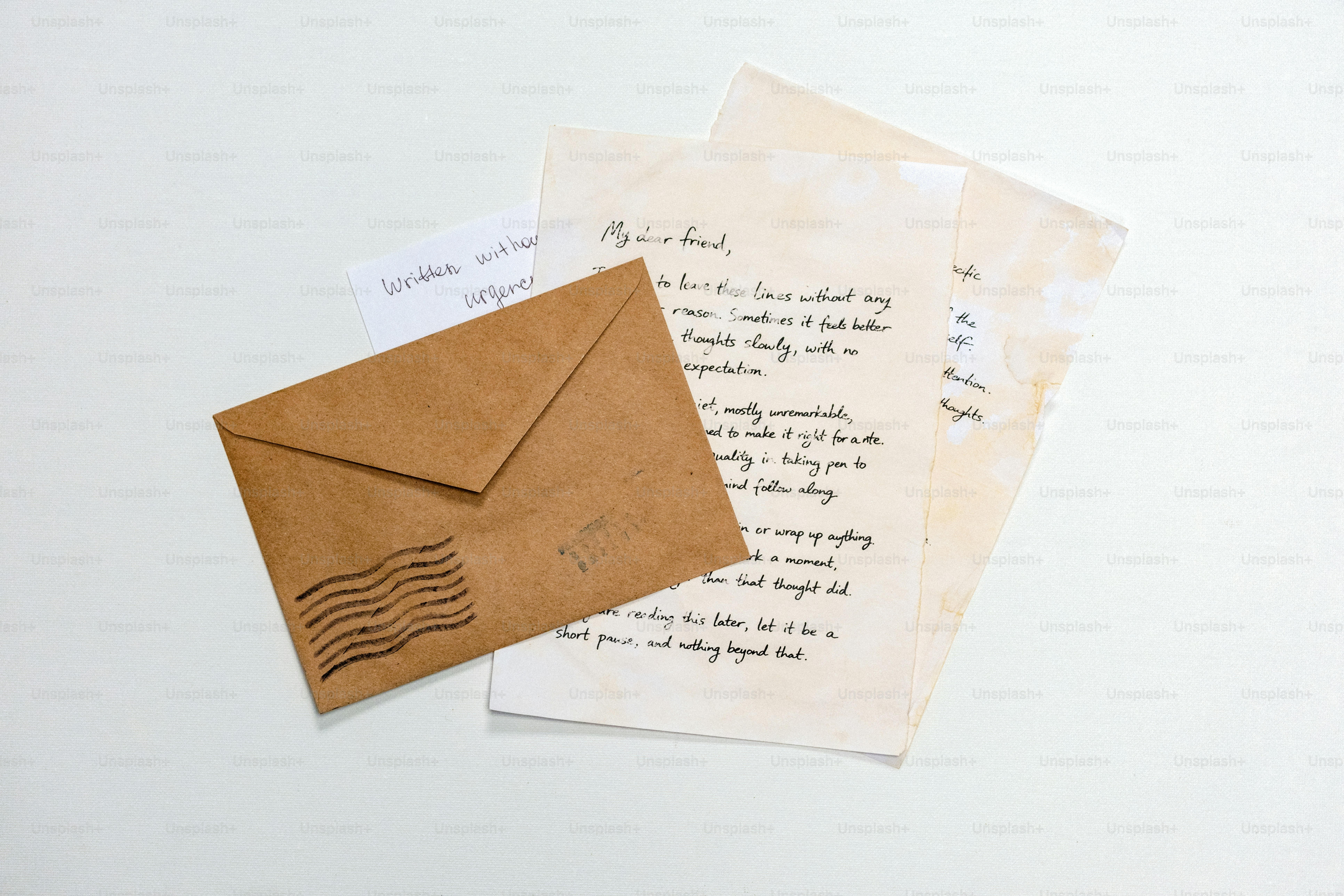 Brown envelope with letters on a white background