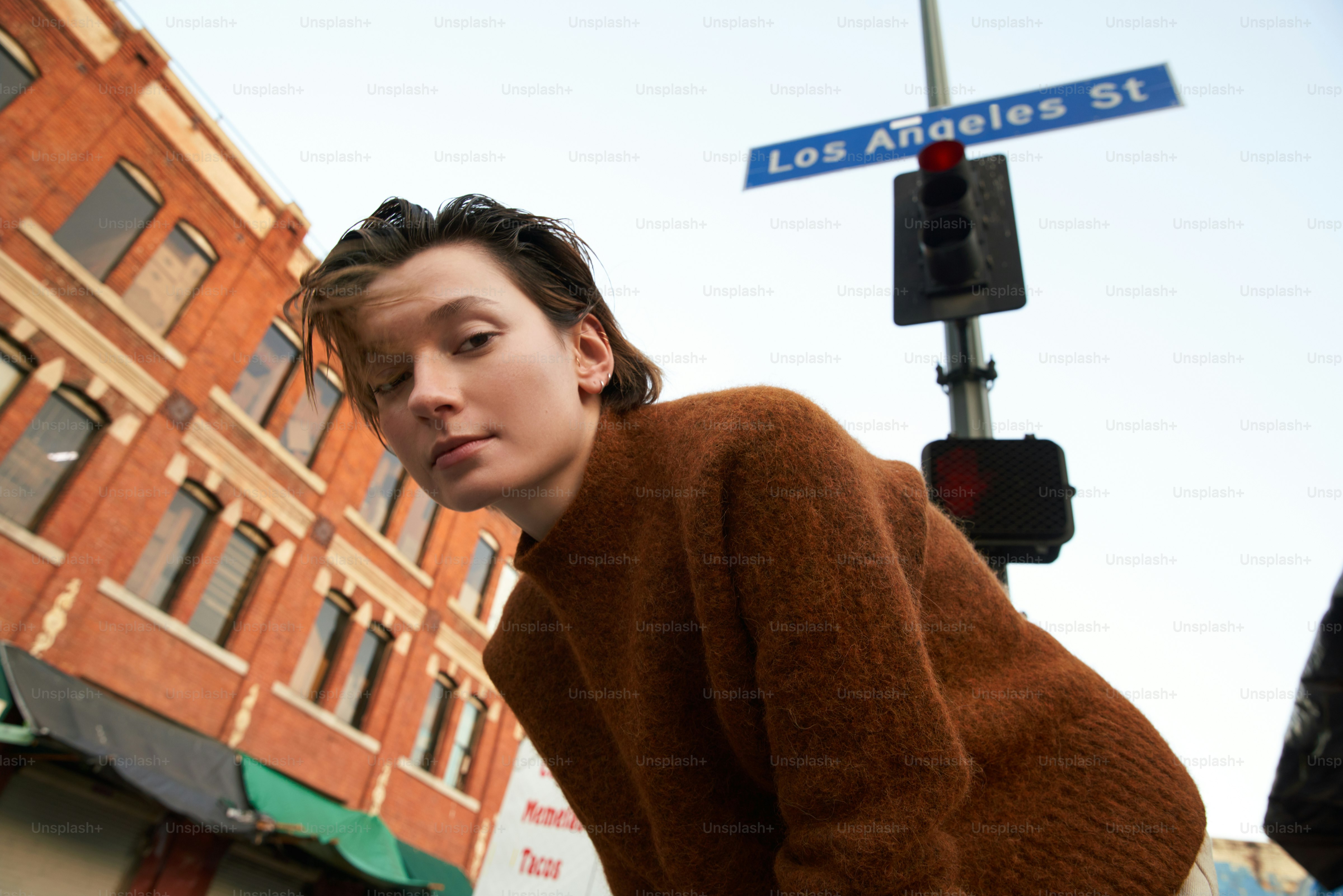 A person in a brown sweater on los angeles street