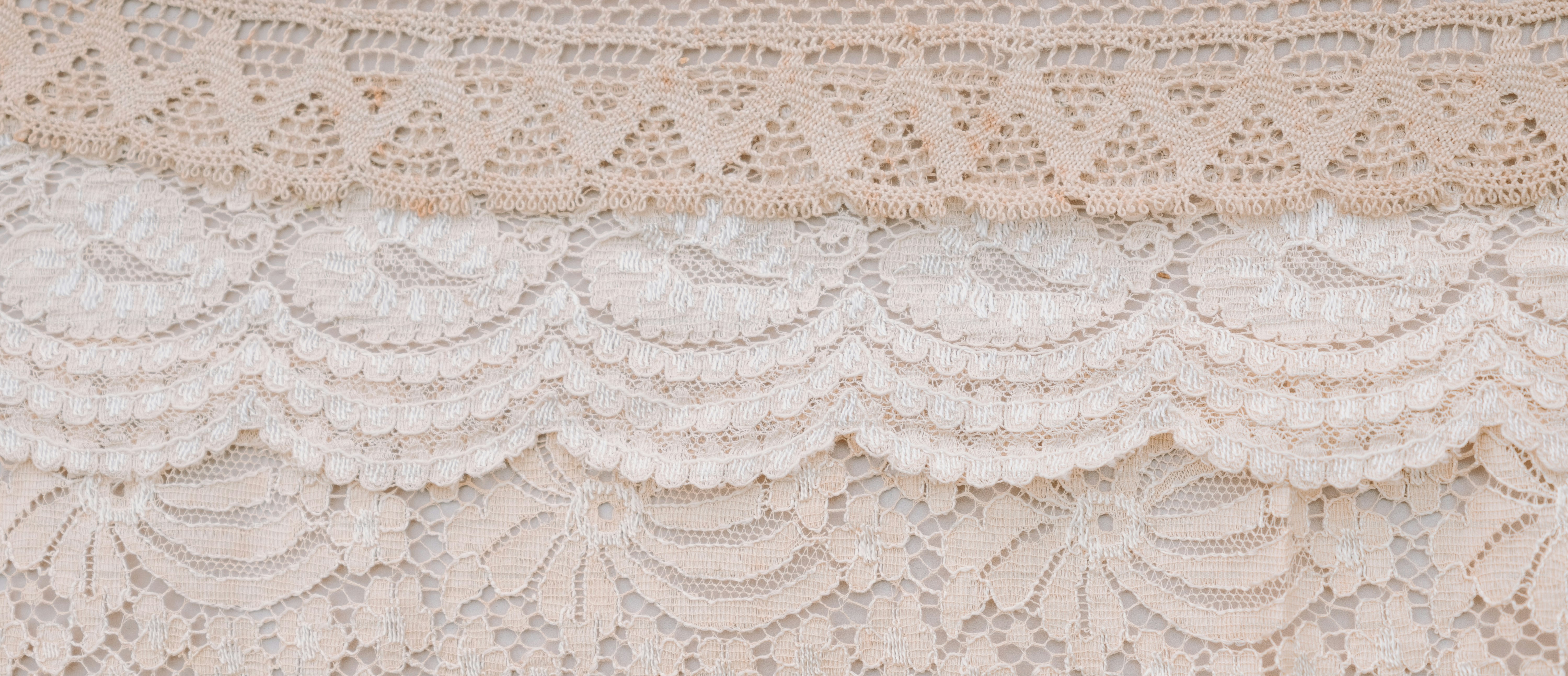 Three layers of delicate lace in neutral tones.