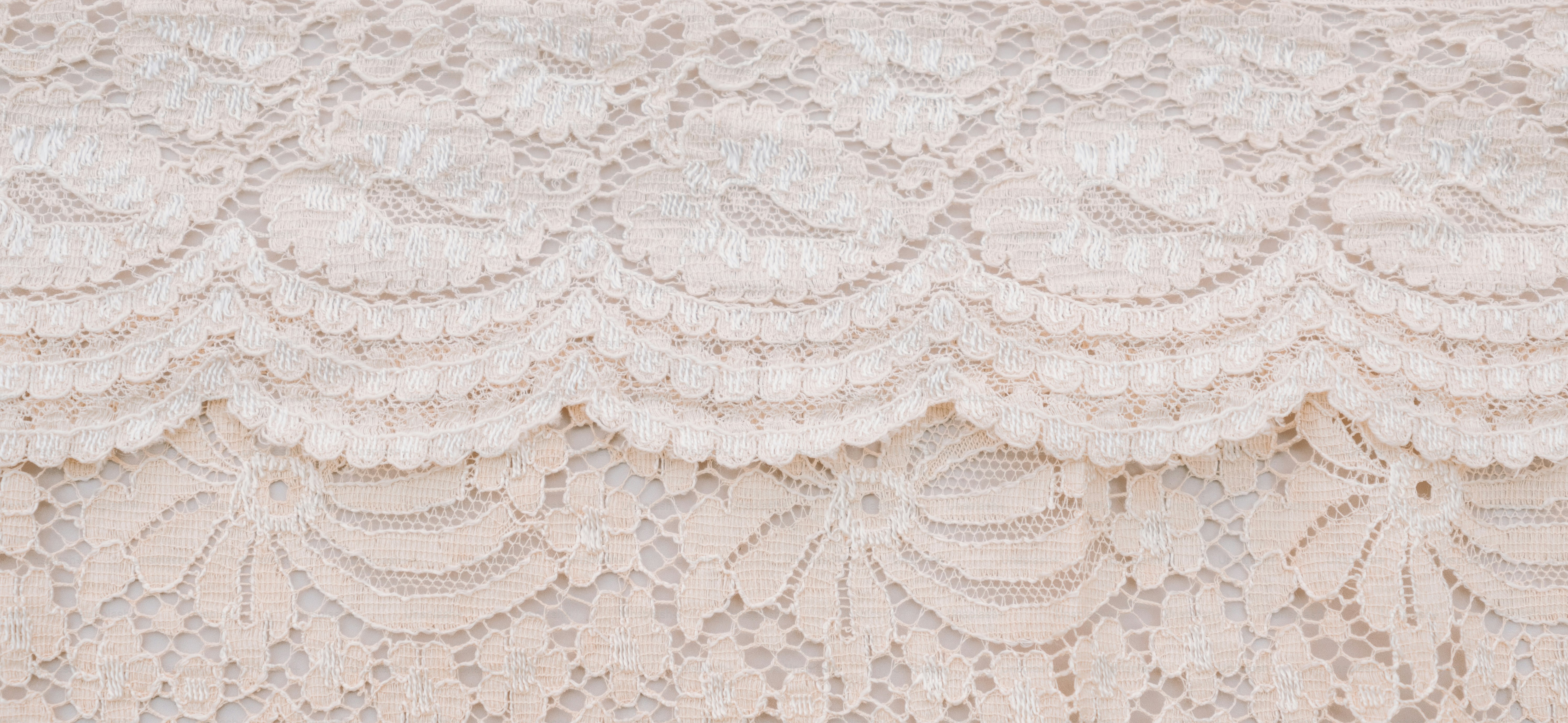 Close-up of delicate cream-colored lace fabric