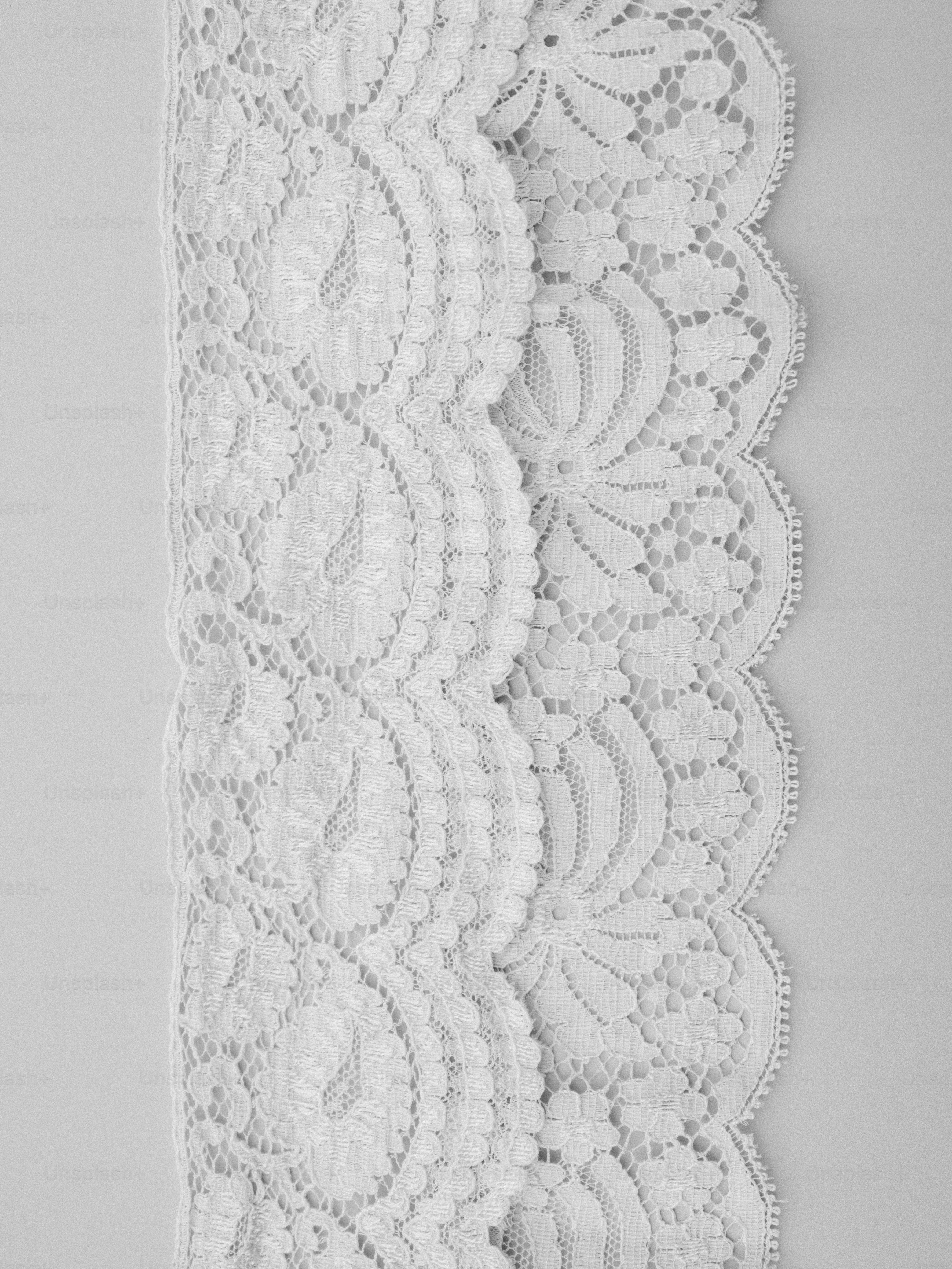 White lace trim with a scalloped edge