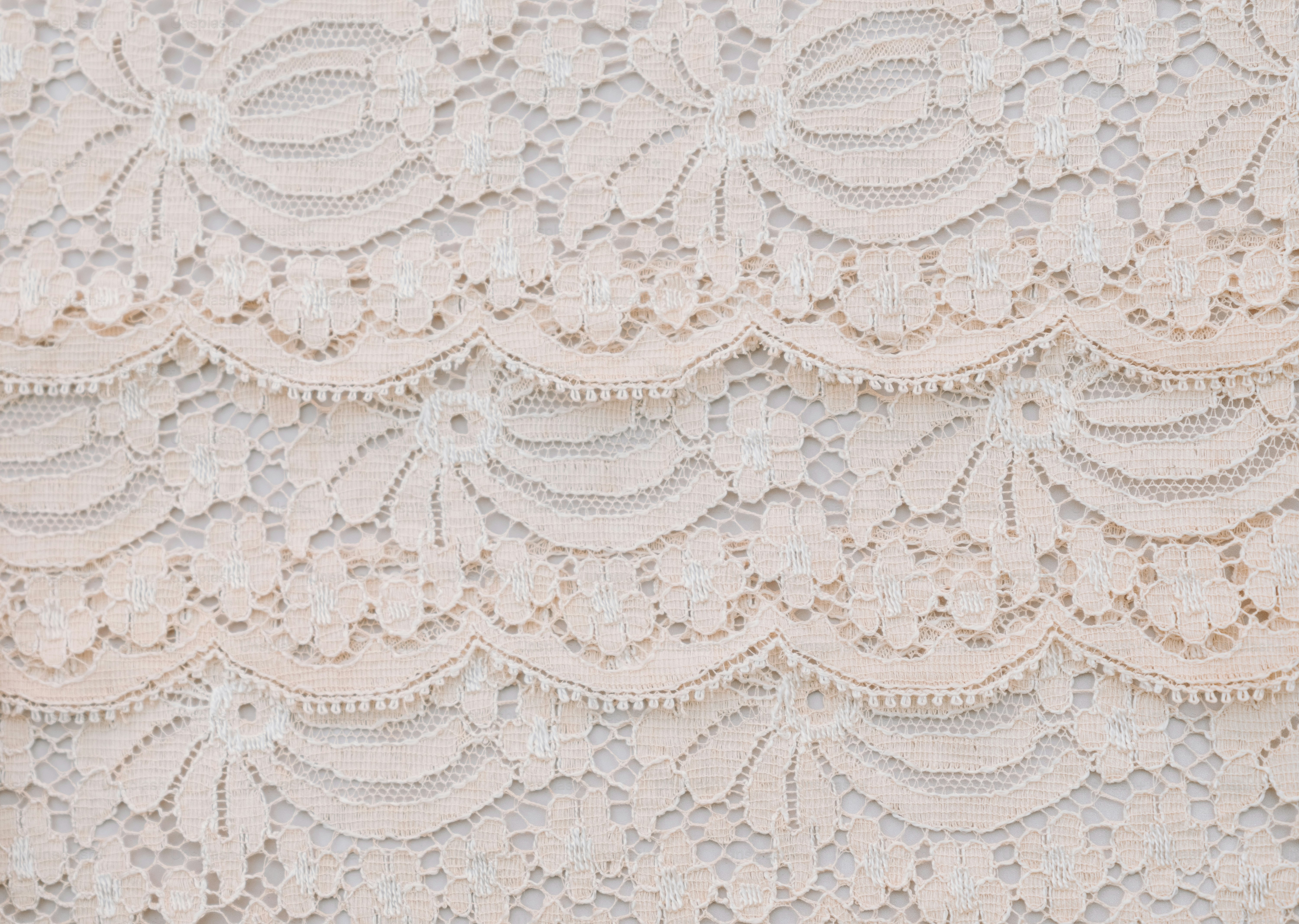 Close-up of delicate white lace fabric pattern