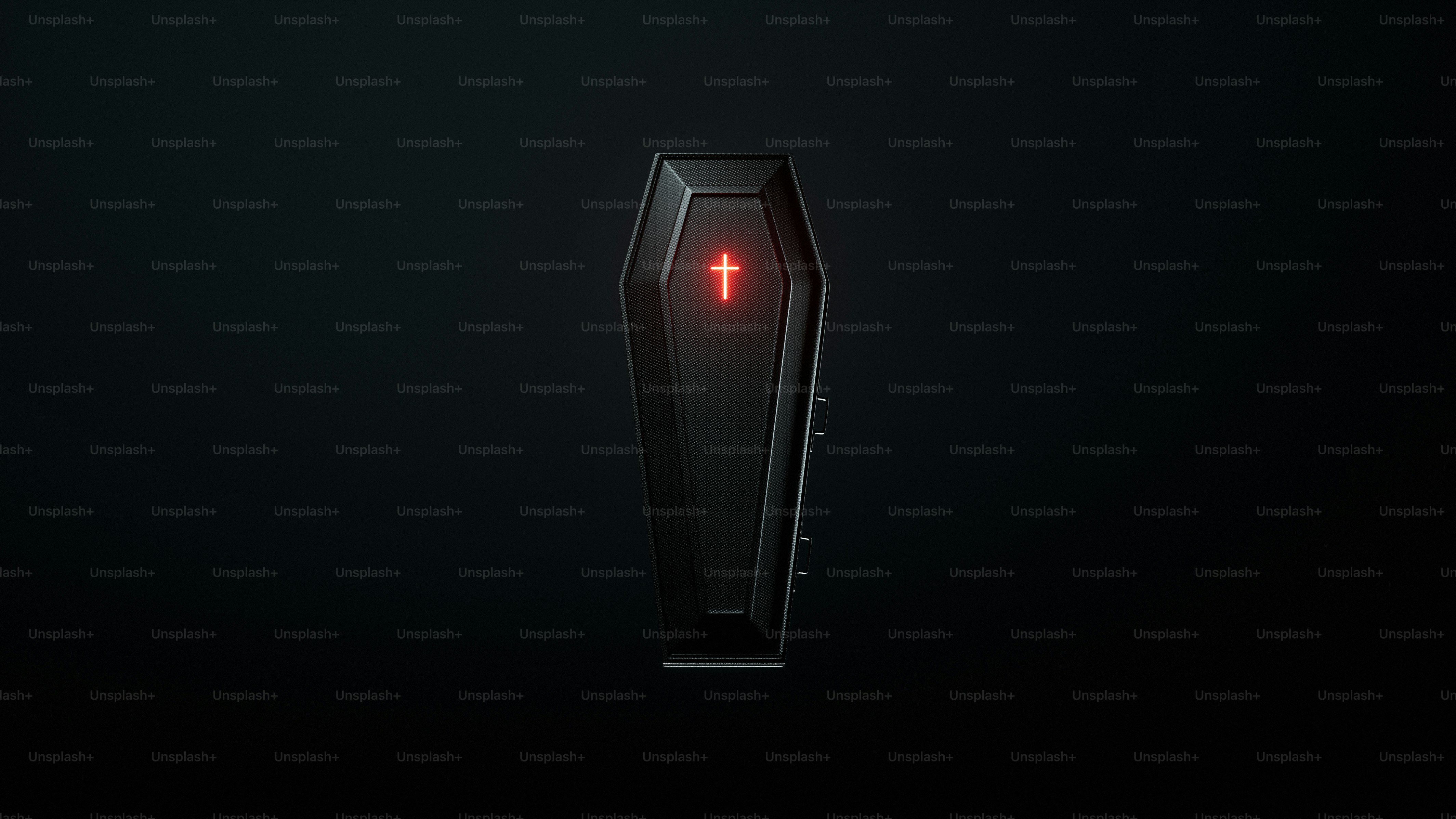 黒い棺の上に赤く光る十字架が載っていた。