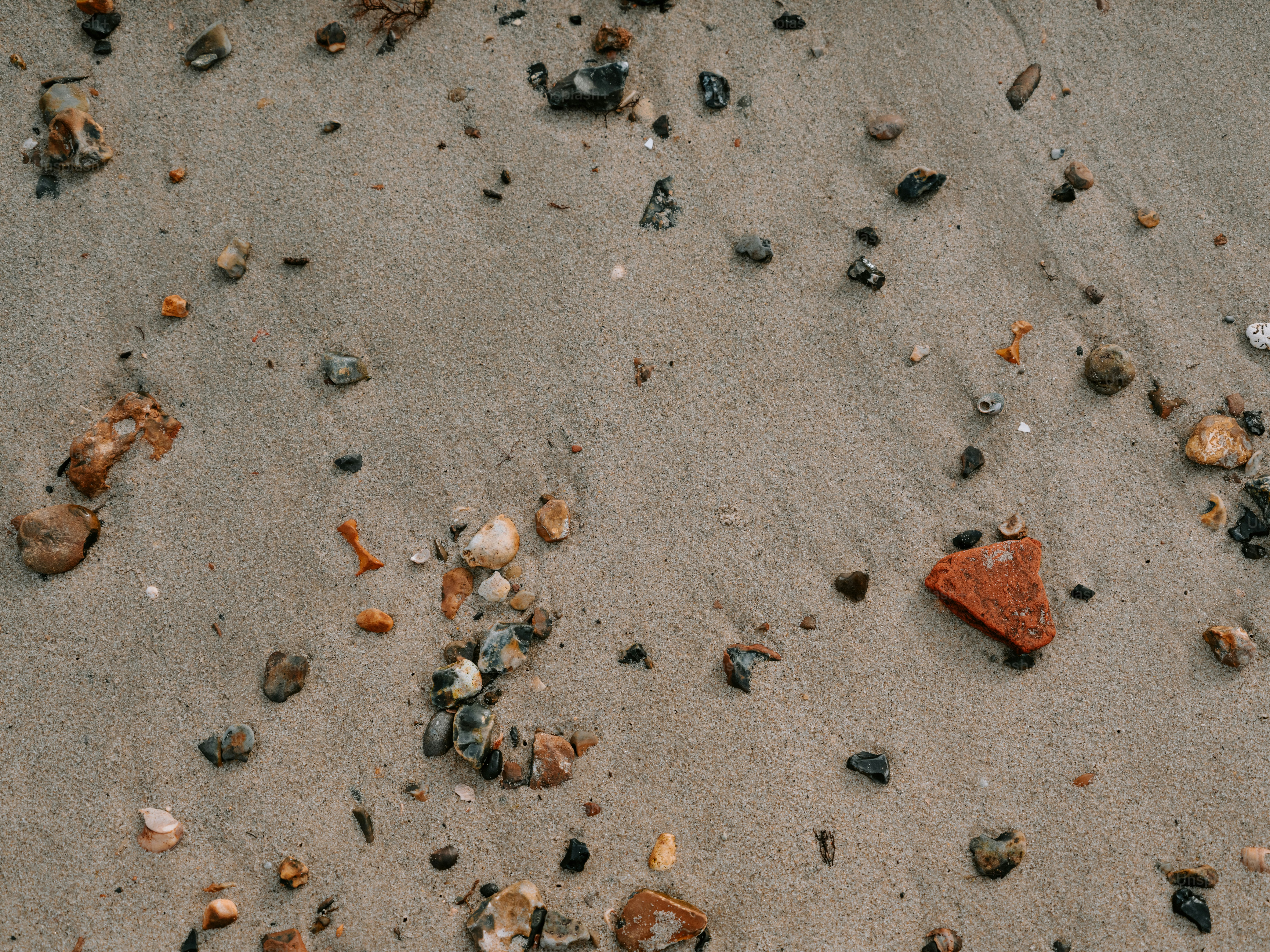 Small stones and sand on a beach photo – Beach Image on Unsplash