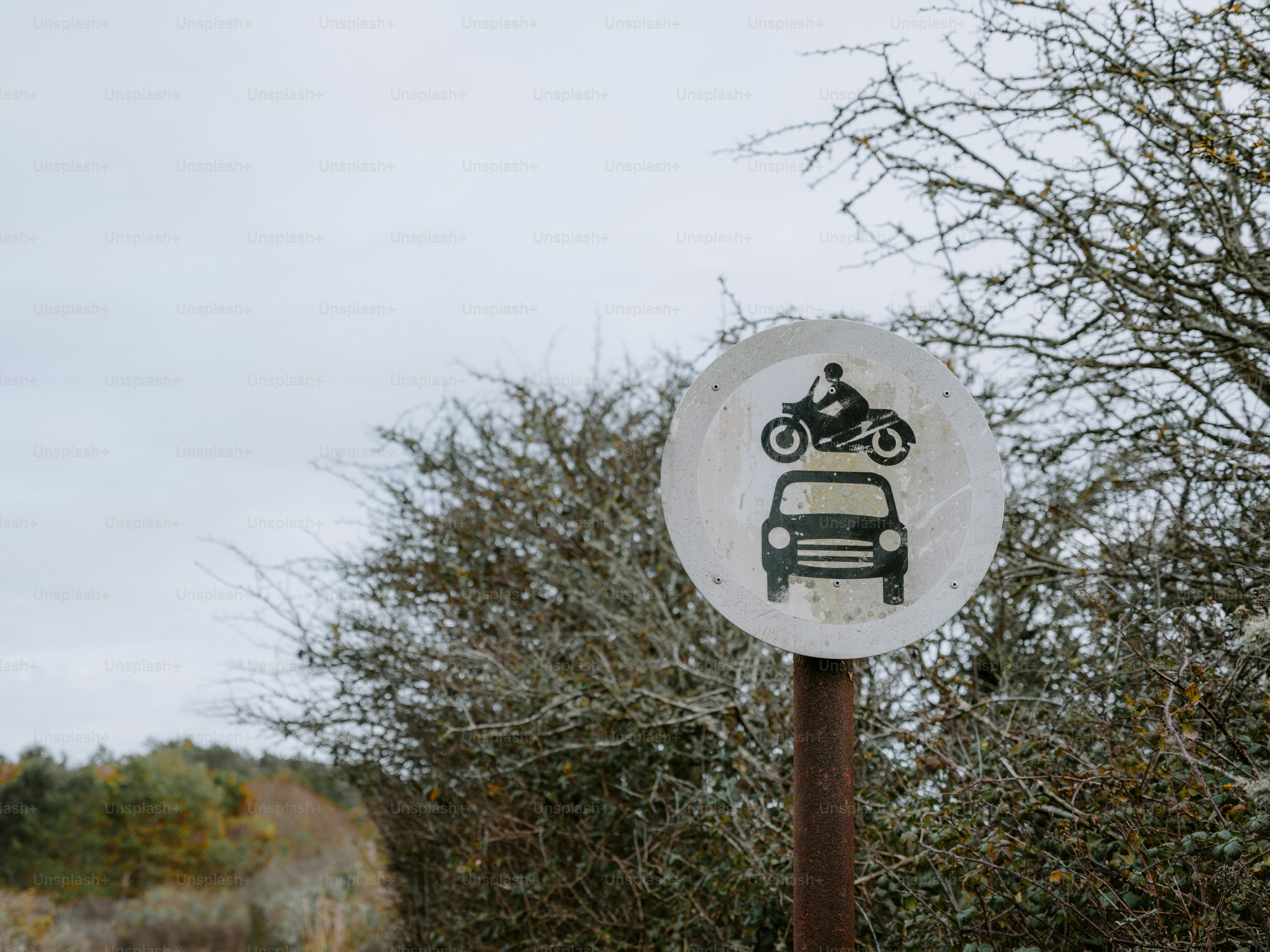 Road sign showing car and motorcycle symbols