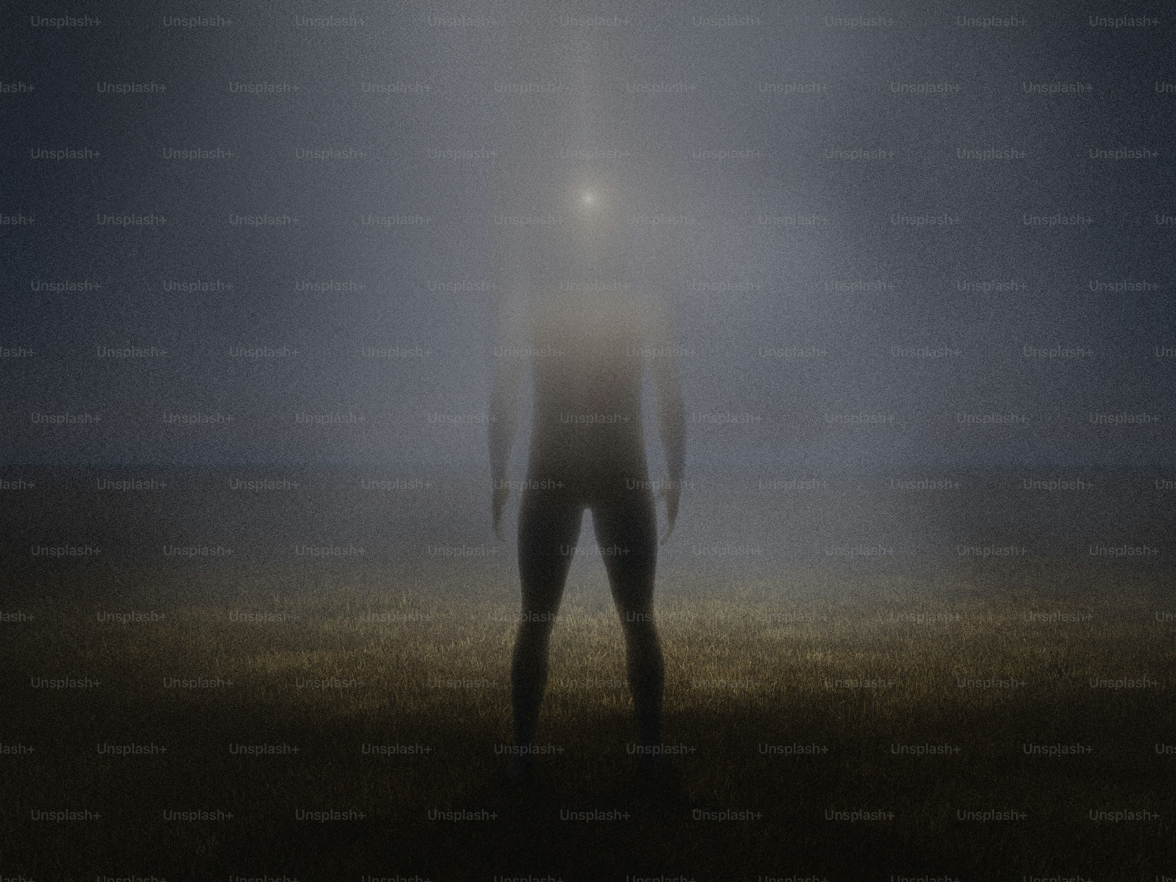 A figure stands in dense fog with a light above.