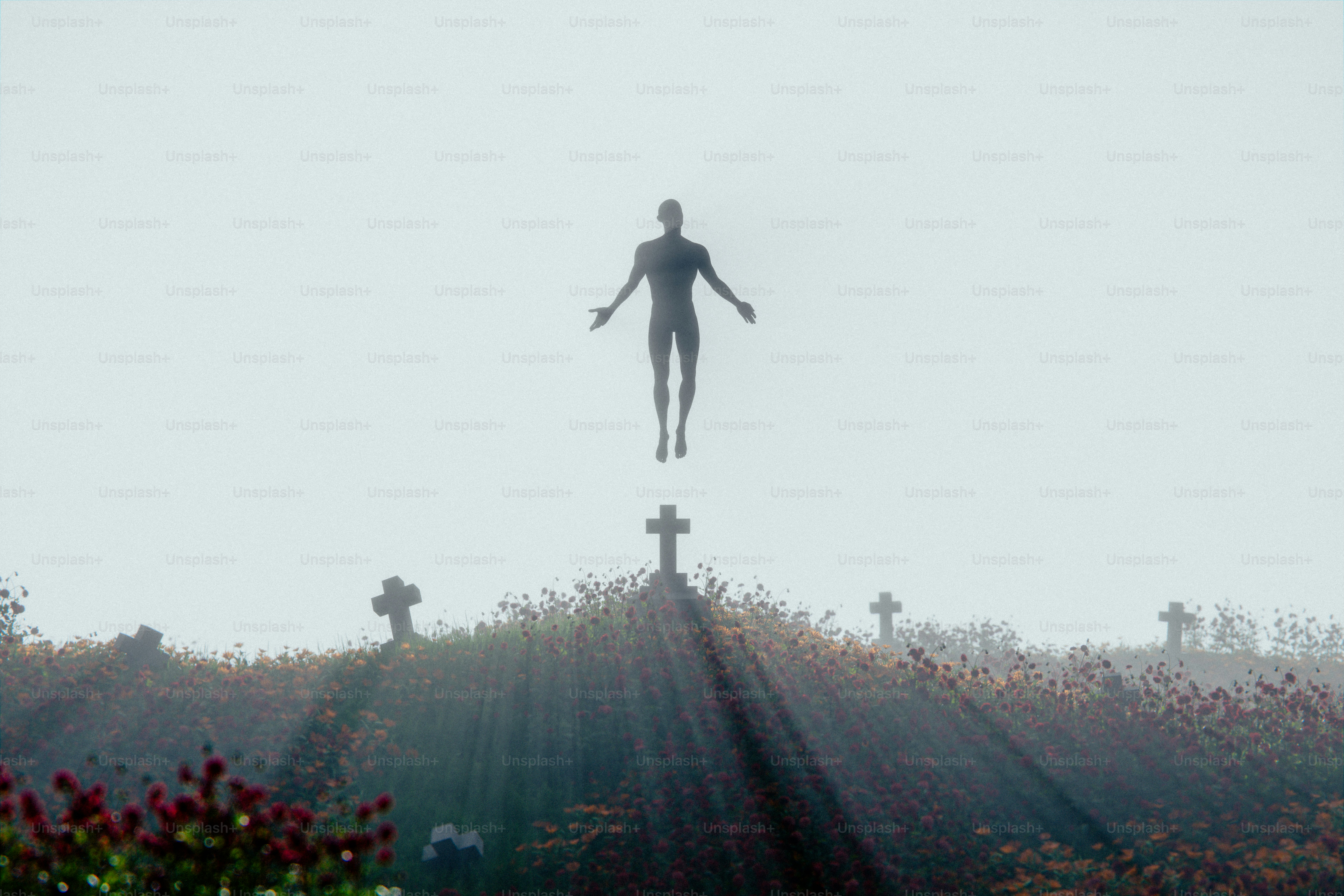 A figure levitates above a misty graveyard with sunbeams.