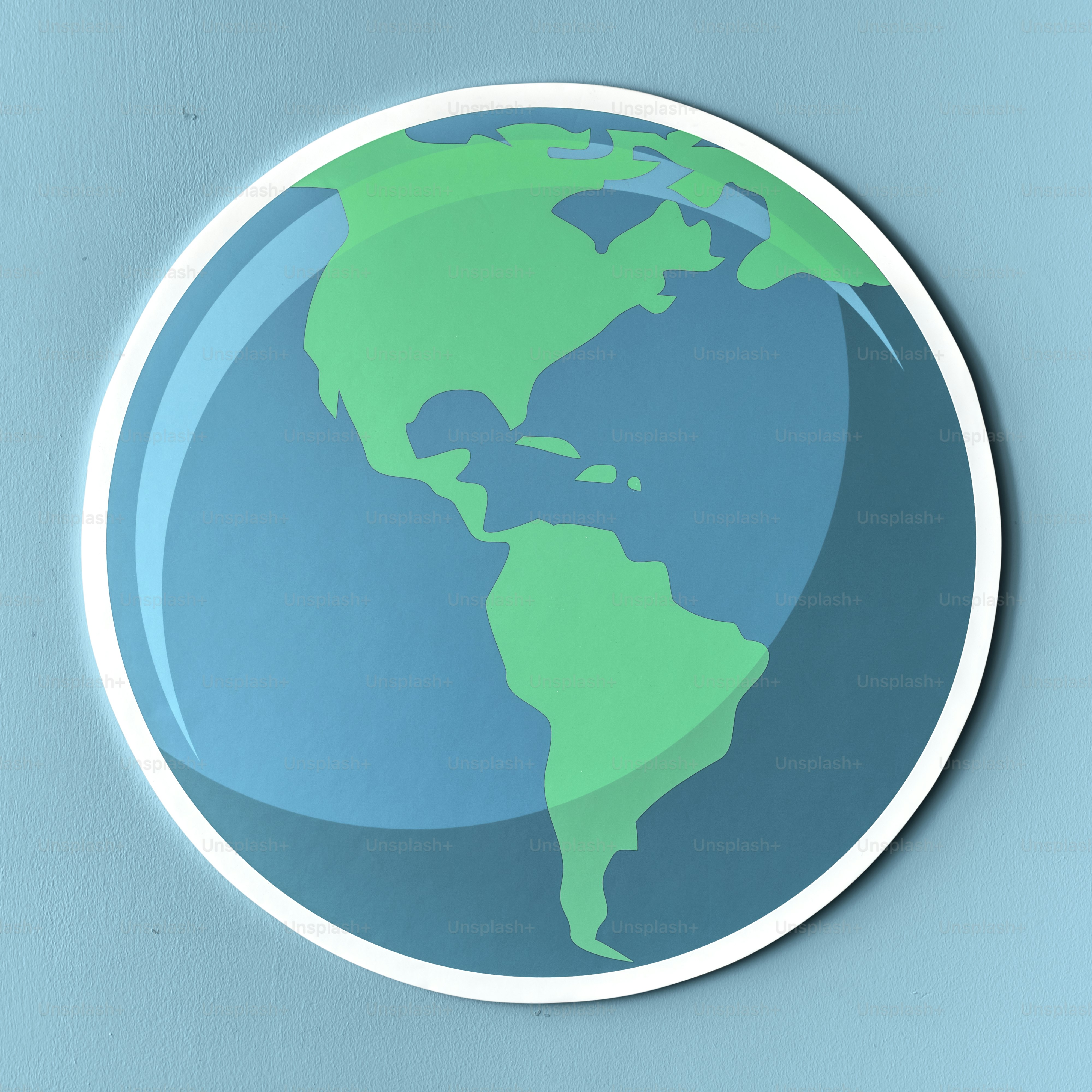 A circular sticker of the Earth with green continents on a blue background