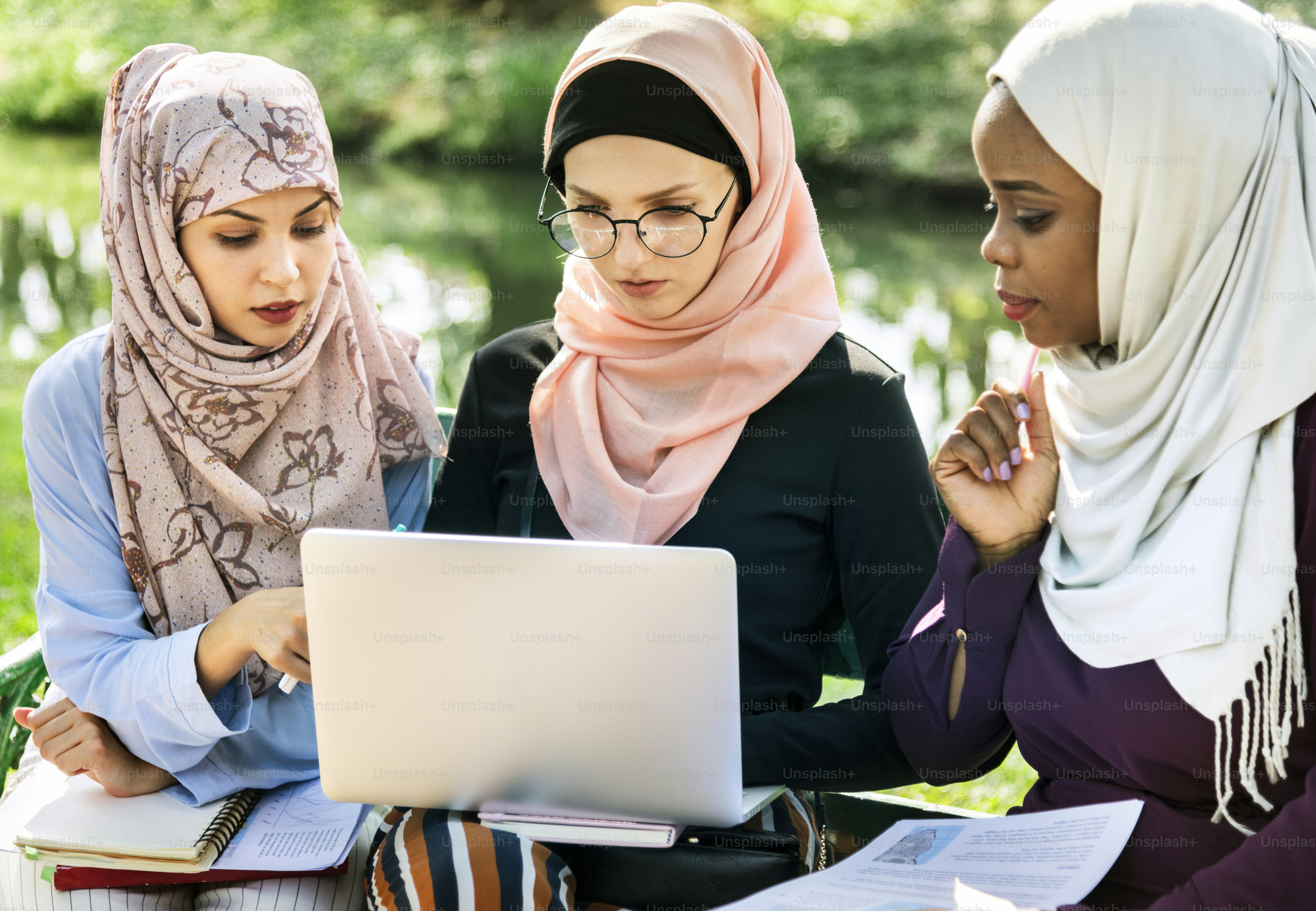 Group of islamic friends discussing and working together