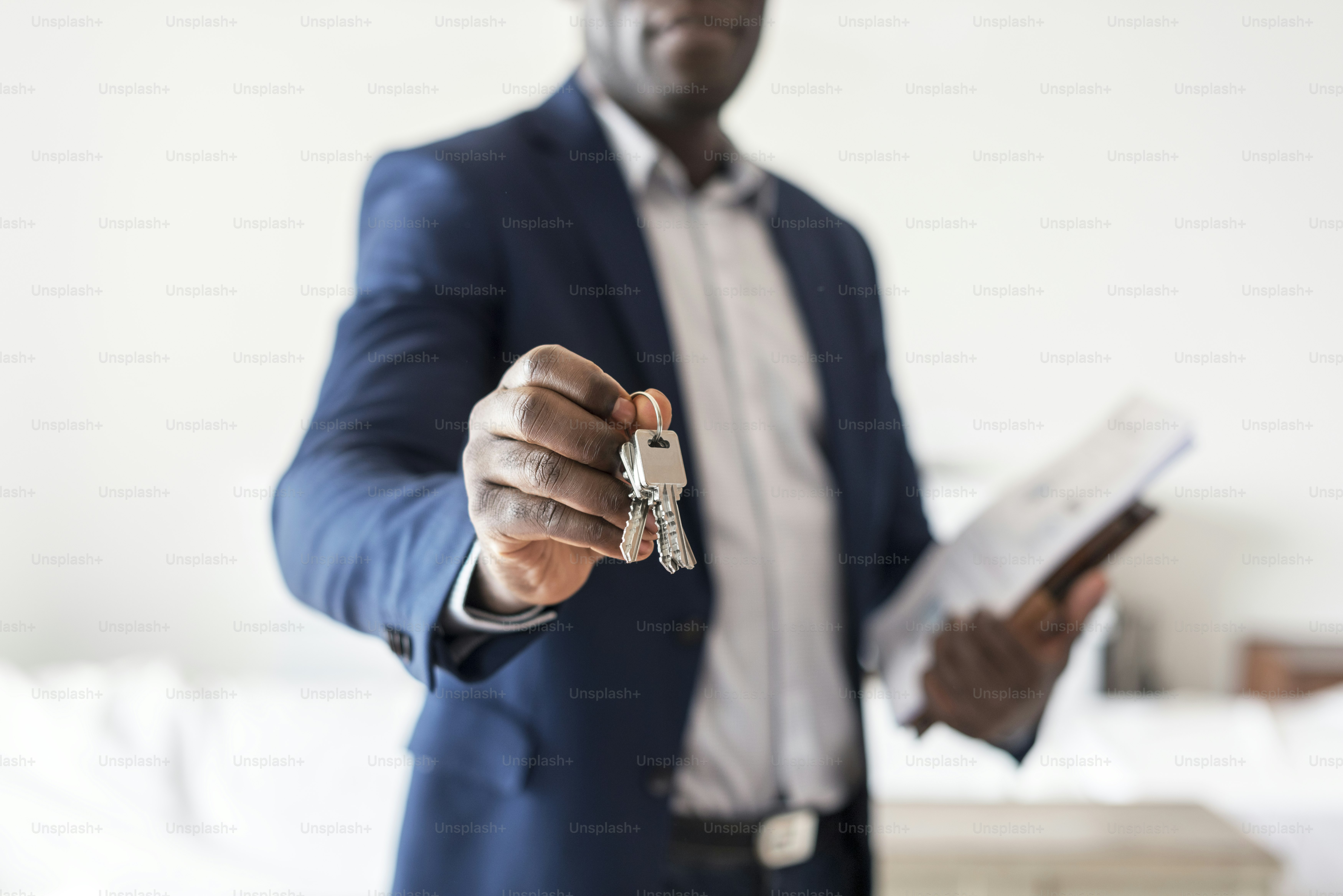Real estate agent handing the house key photo – People Image on Unsplash
