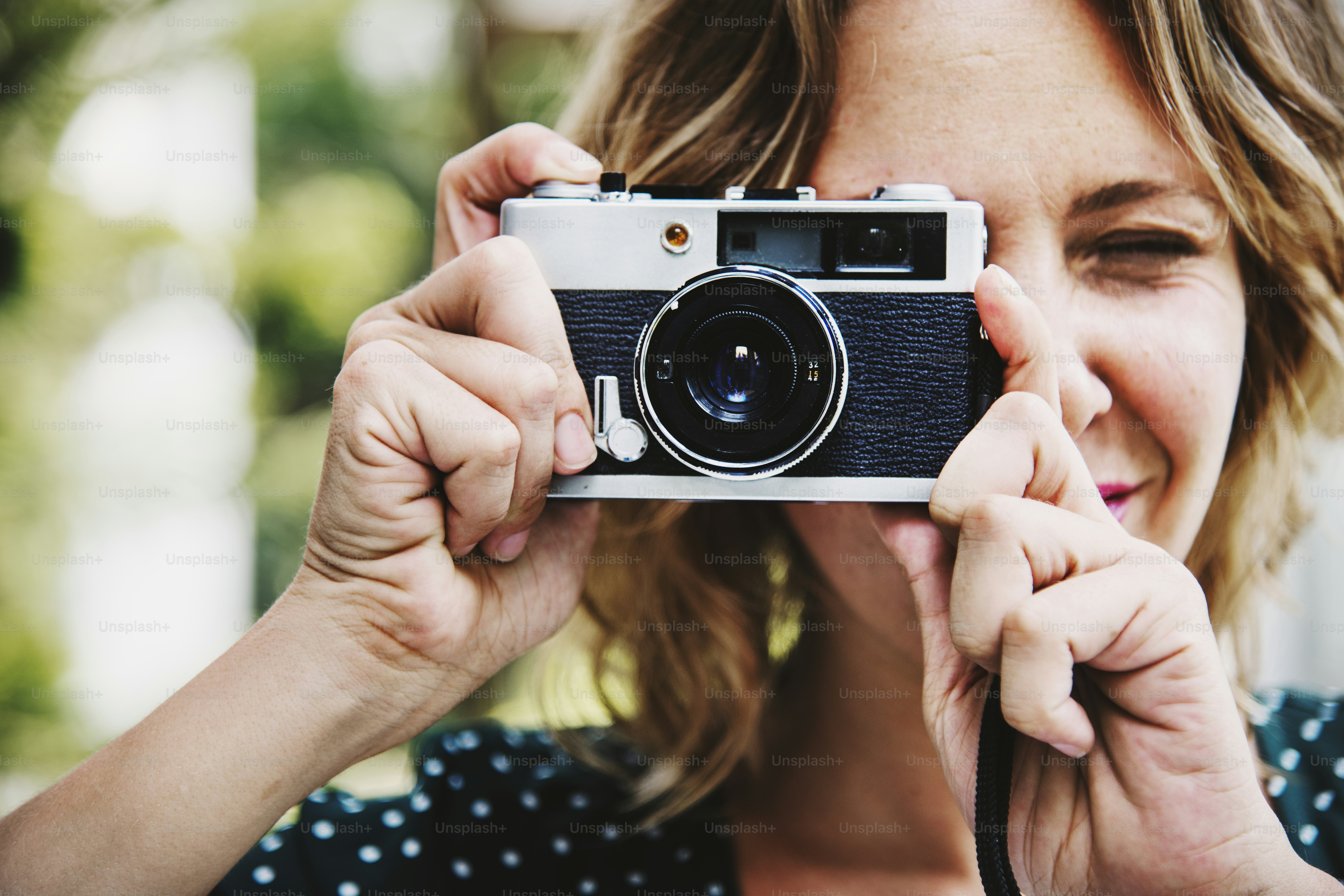 Woman taking picture with camera
