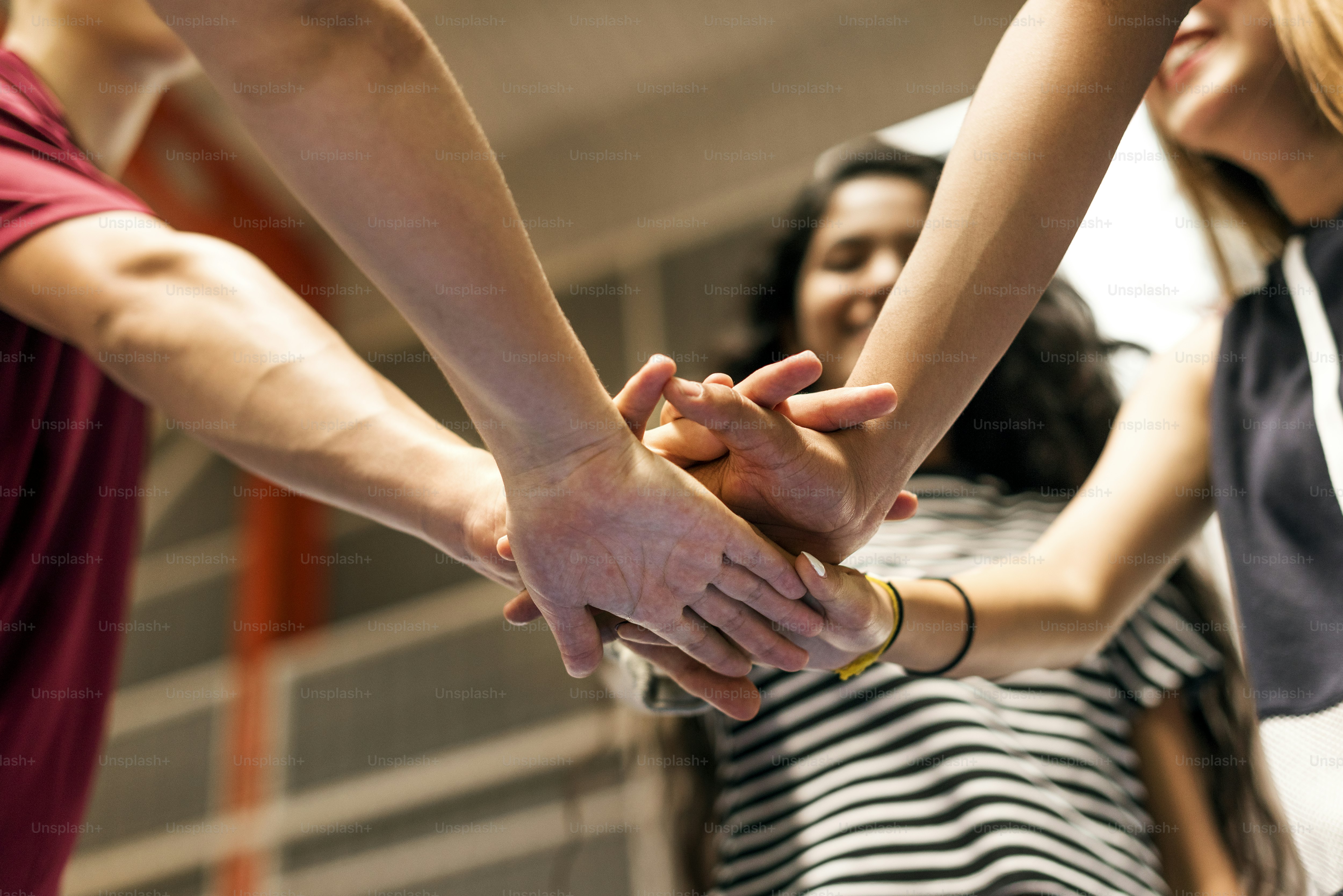 Group of teenager friends on a basketball court teamwork and togetherness concept