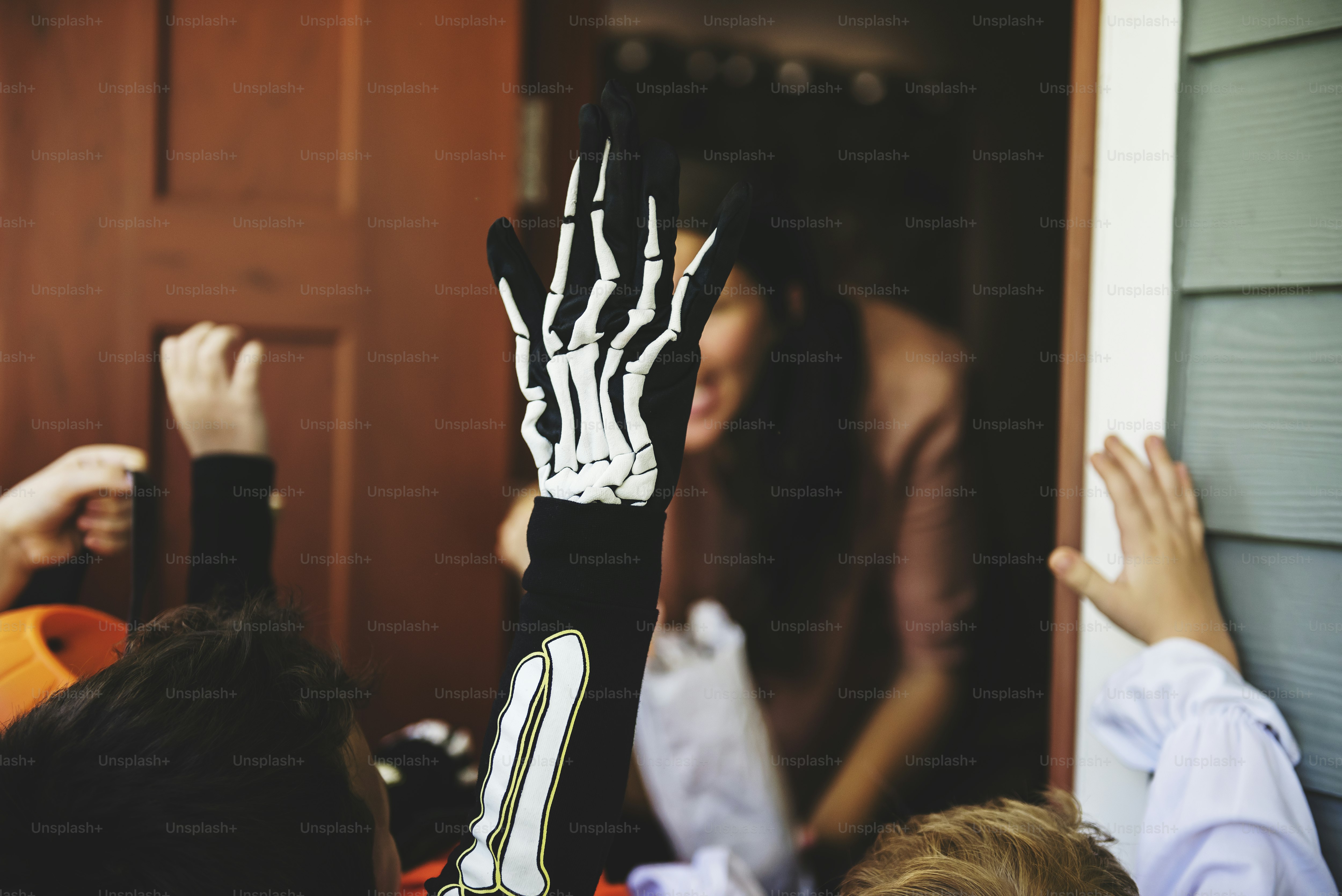 Little children trick or treating on Halloween
