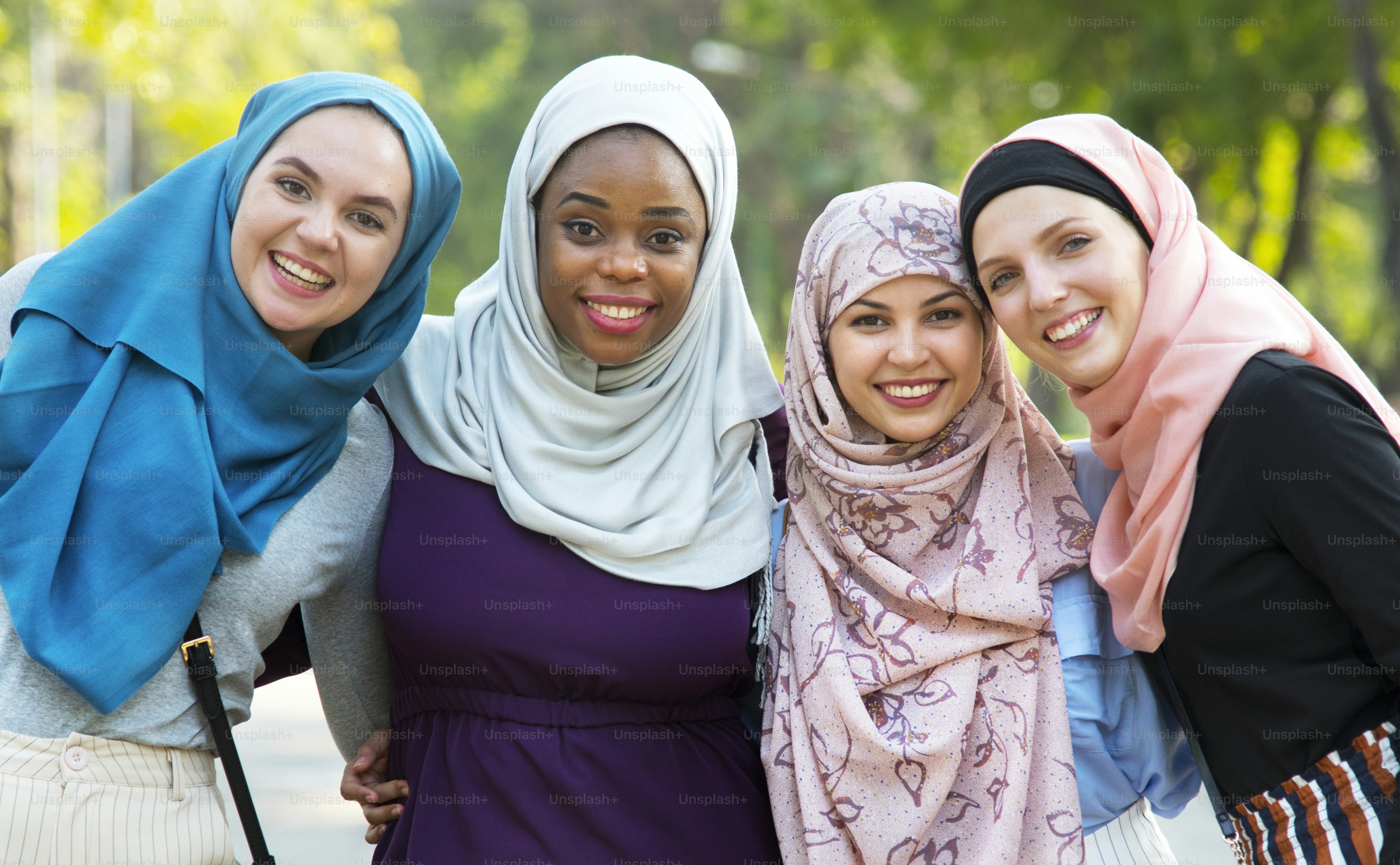 Group of islamic friends embracing and smiling together