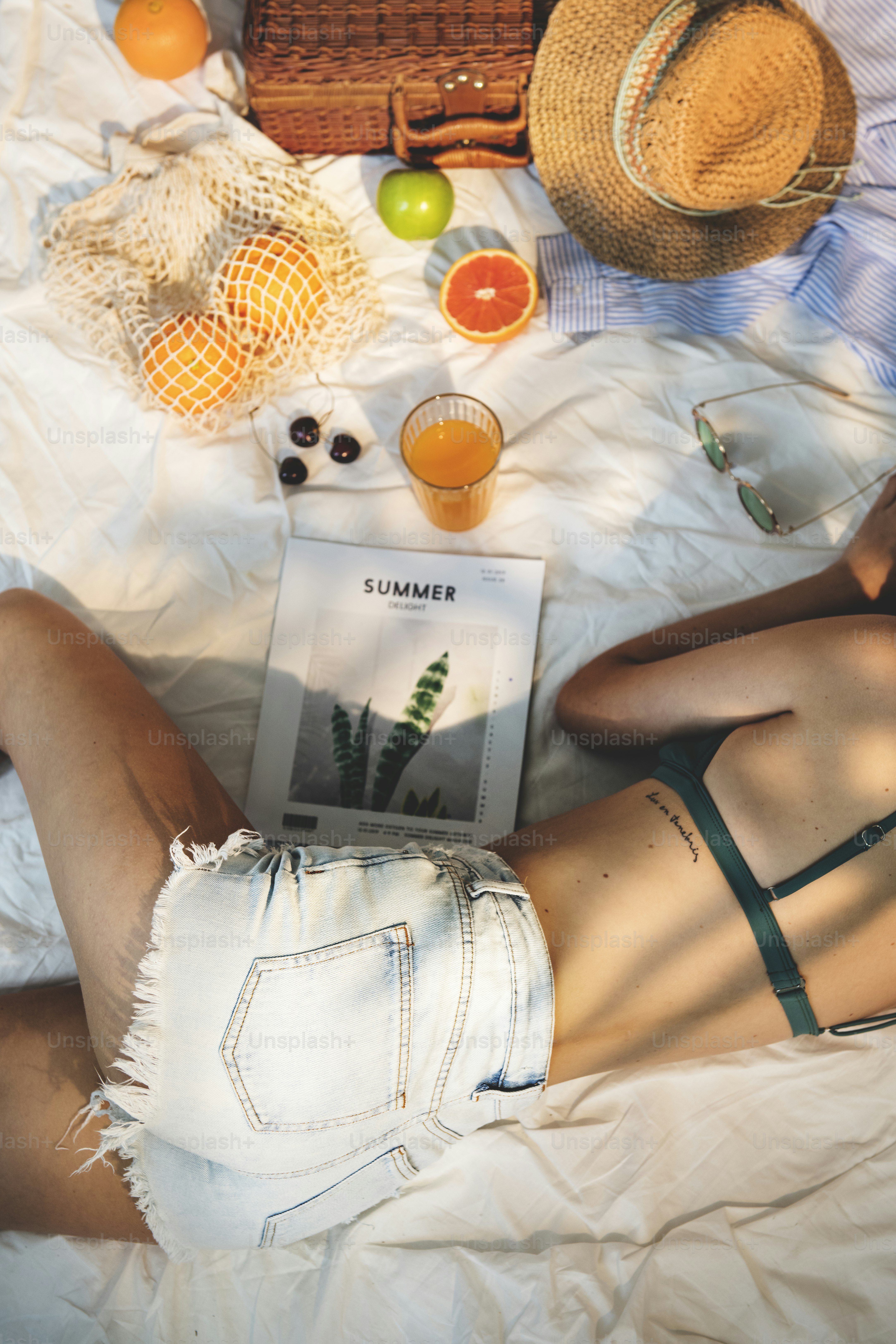 Girl in swimsuit having a picnic***These documents are our own generic designs. They do not infringe on any copyrighted designs.