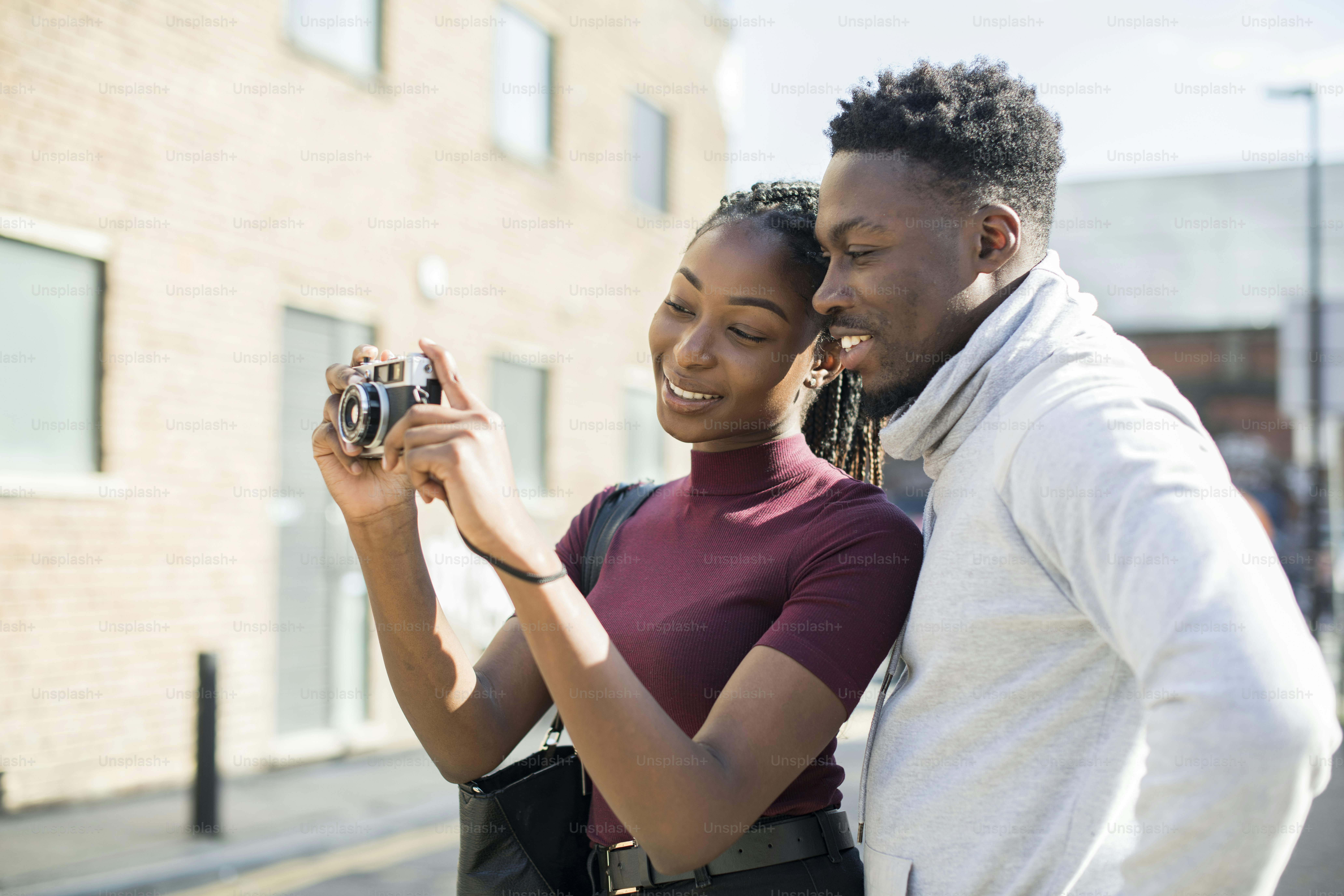 Woman using an analog film camera