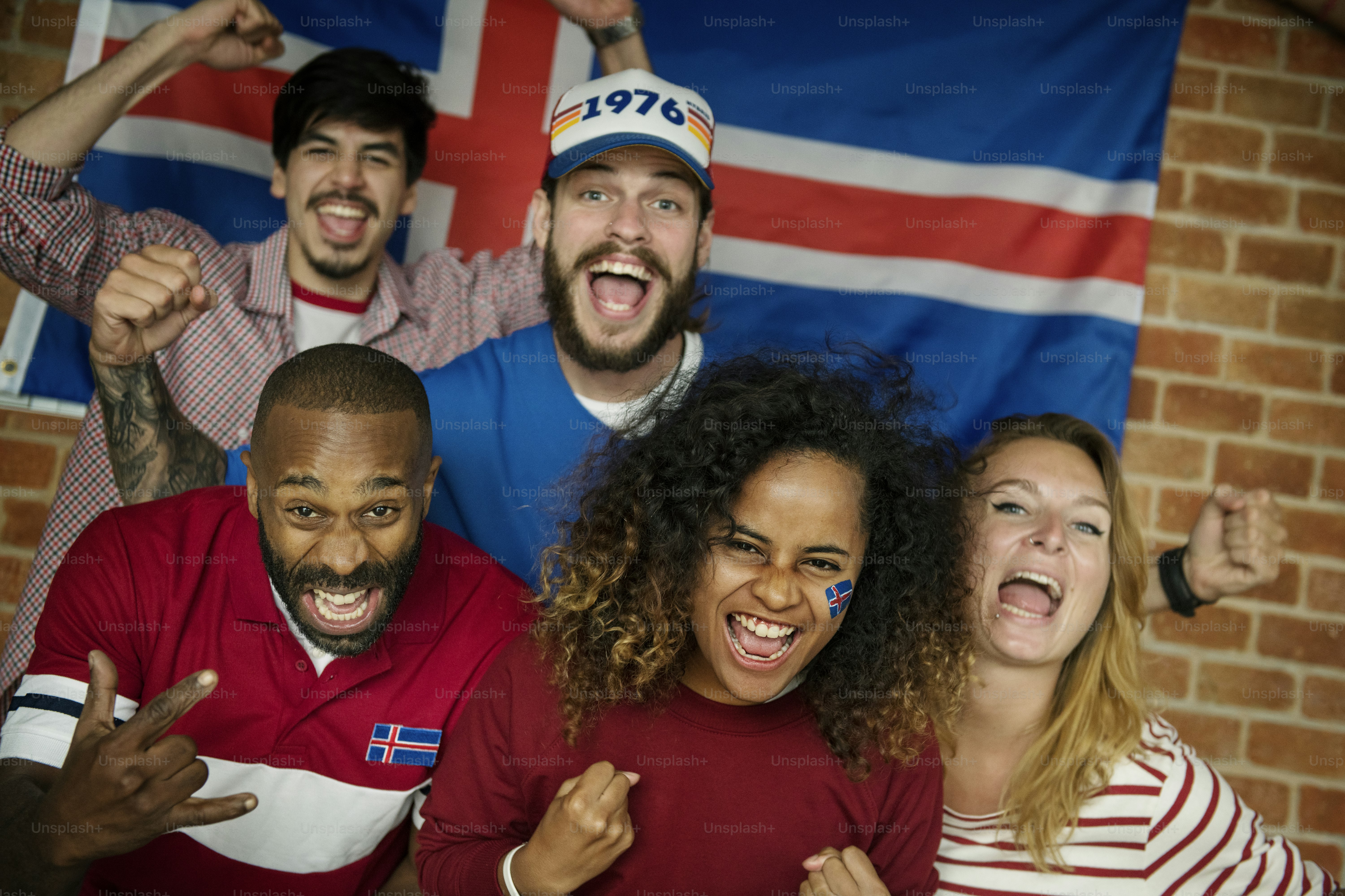 Friends cheering world cup with painted flag