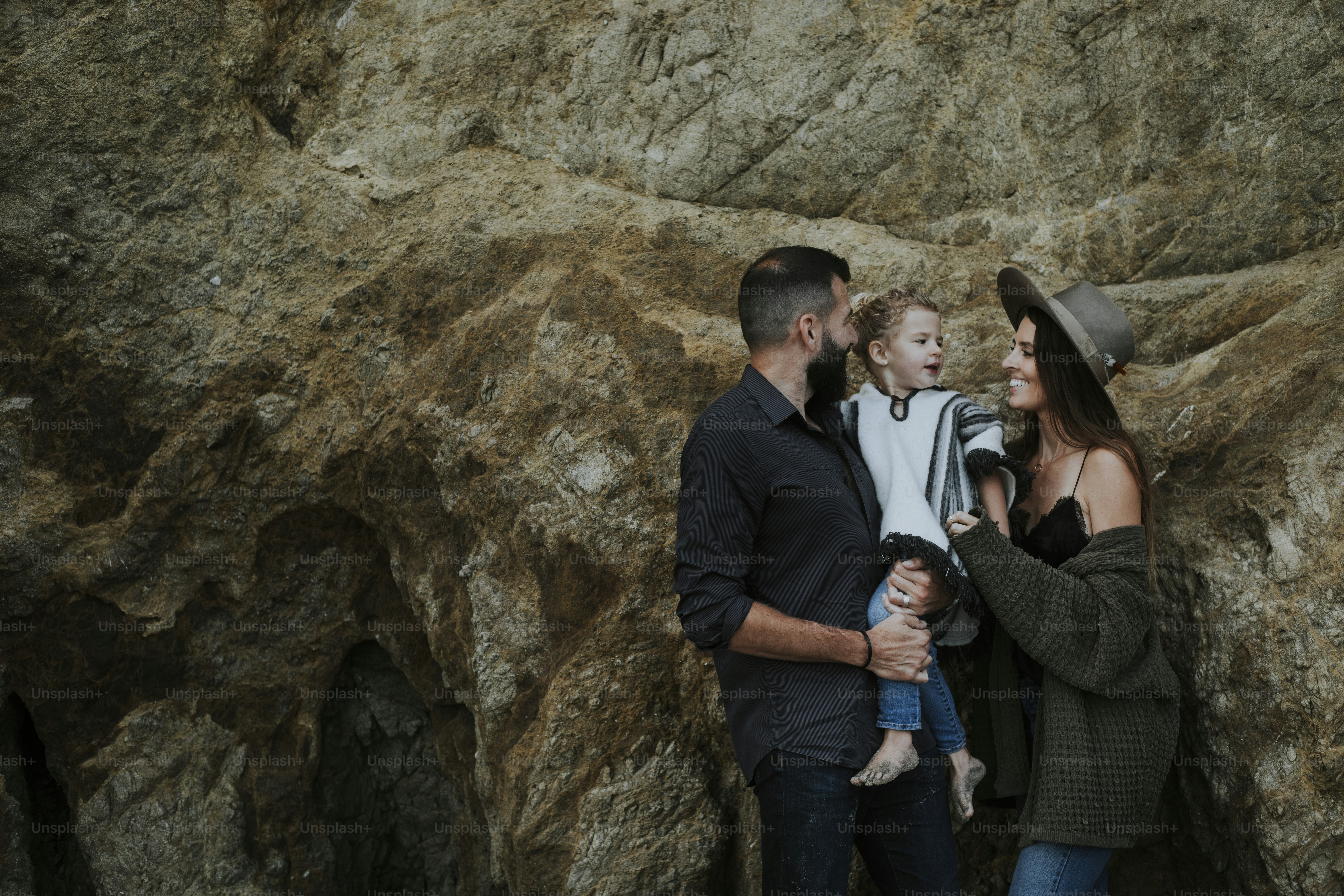 Family portrait with a big rock backdrop