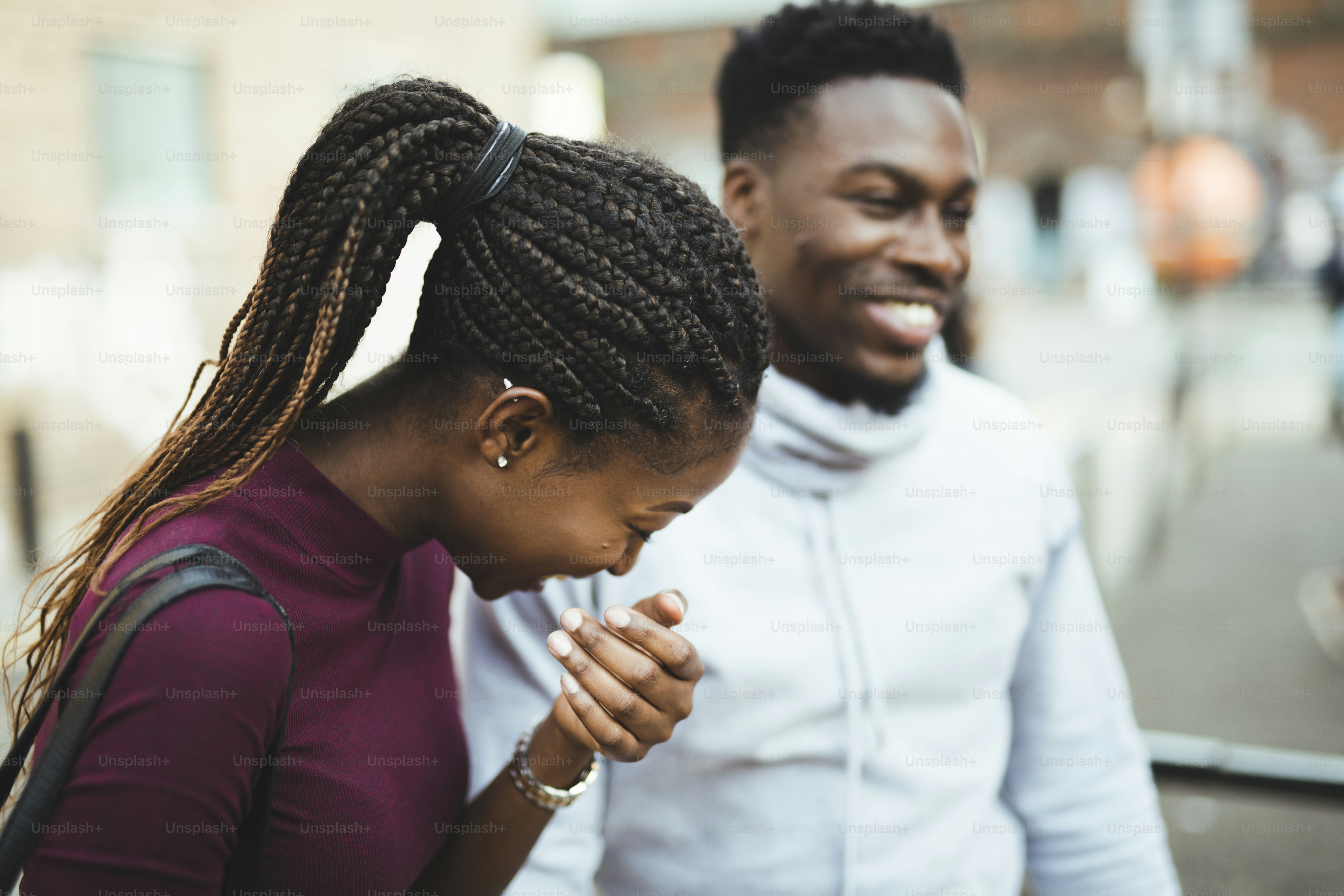 Happy couple walking around in the city