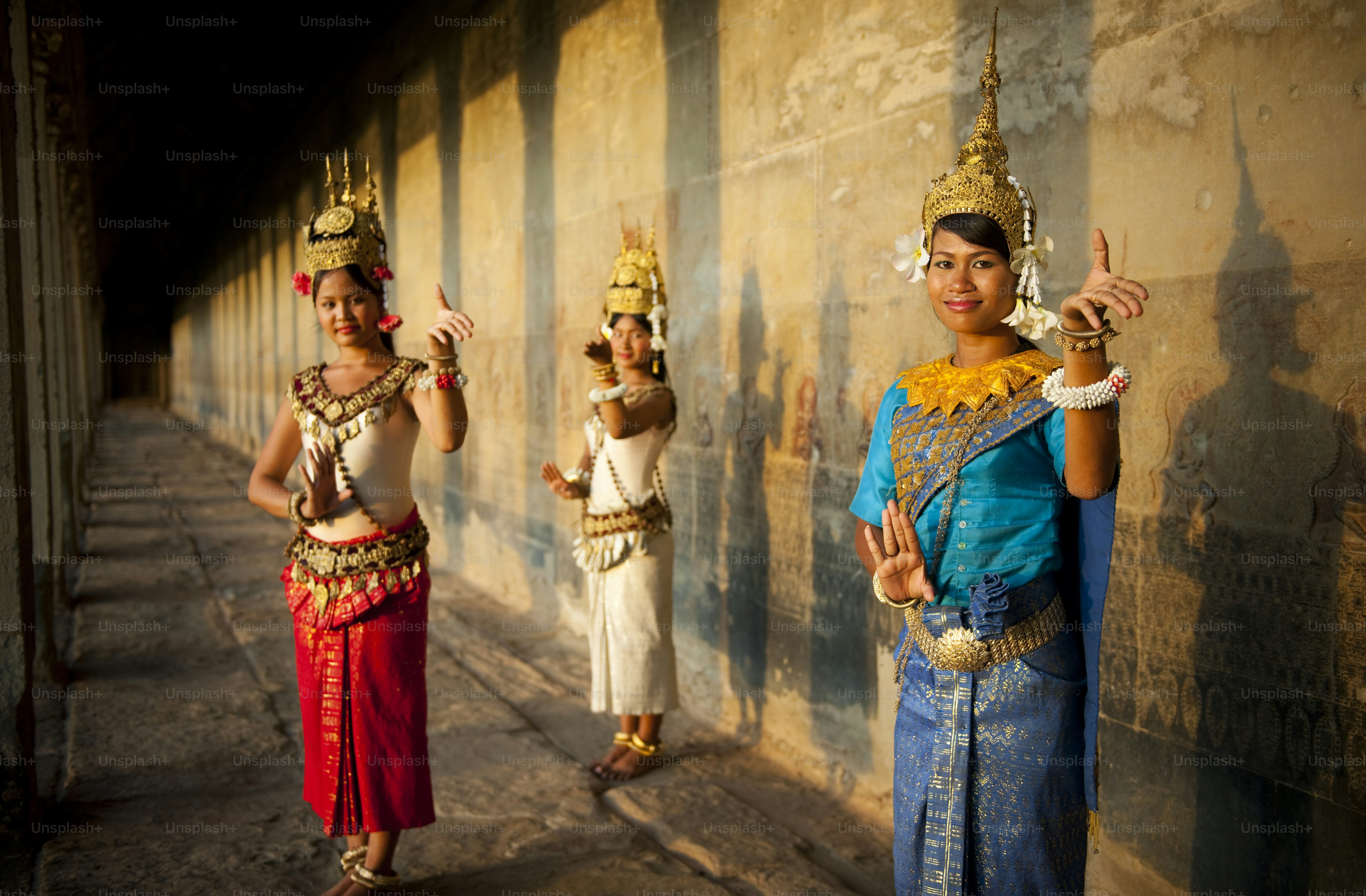 Three women in traditional cambodian dance costumes