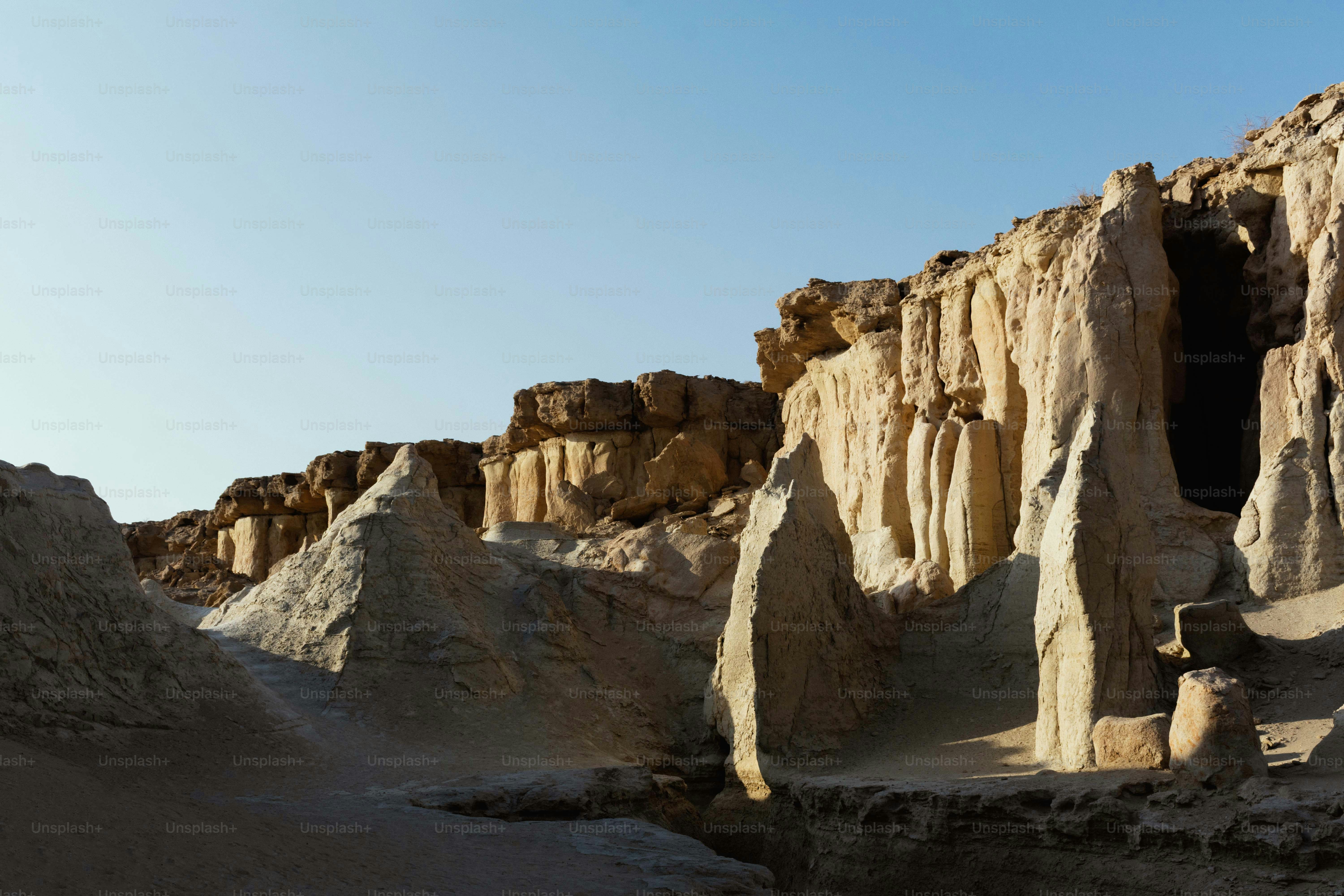 Rocky desert landscape with unique rock formations photo – Desert ...