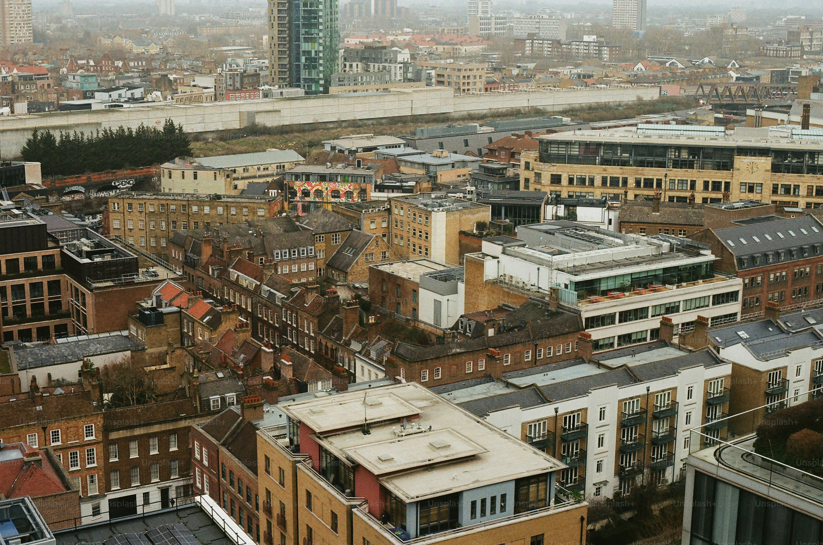 Aerial view of a dense urban cityscape with varied buildings. photo ...