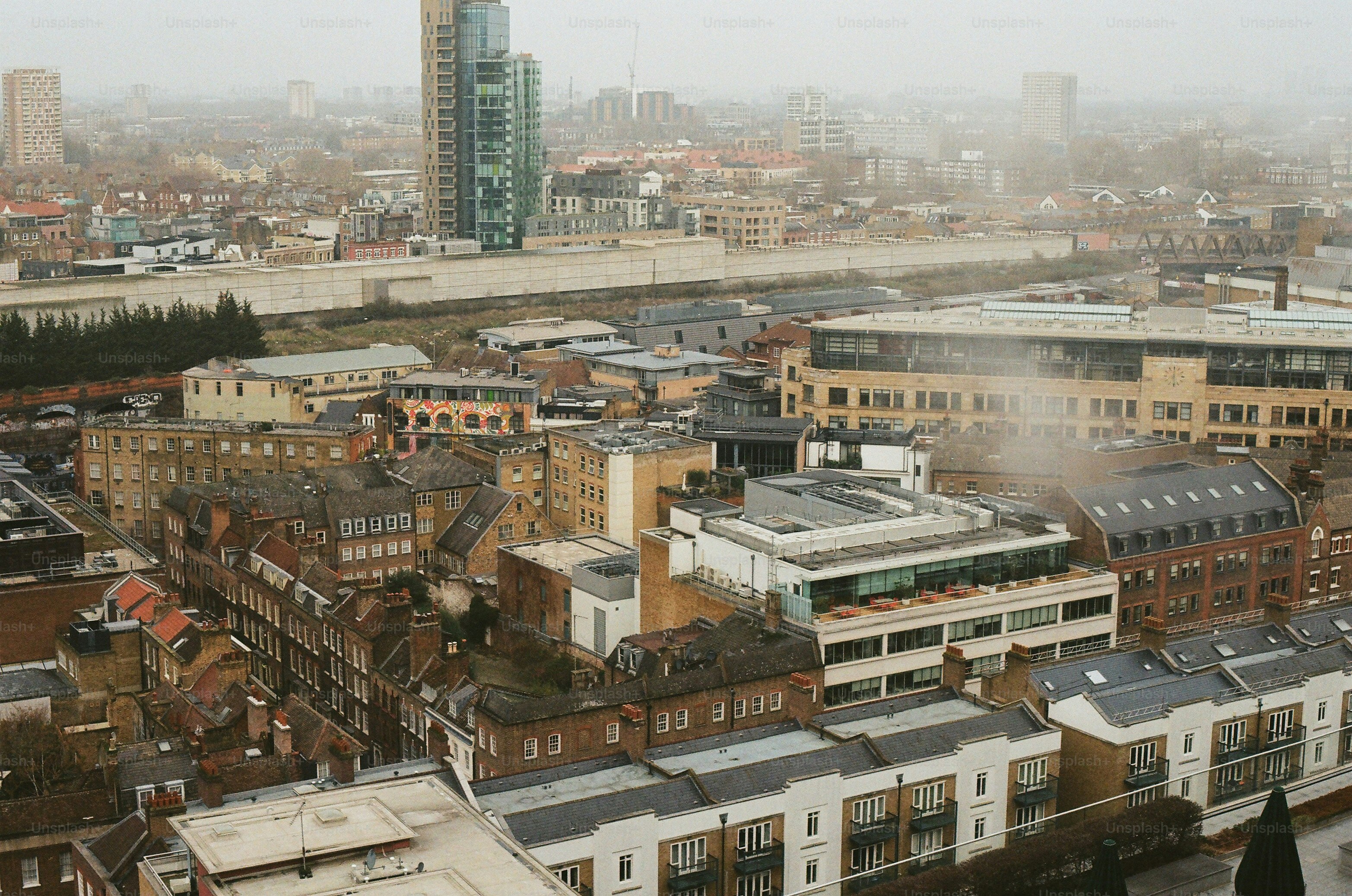 Overhead view of a misty urban cityscape with buildings. photo ...