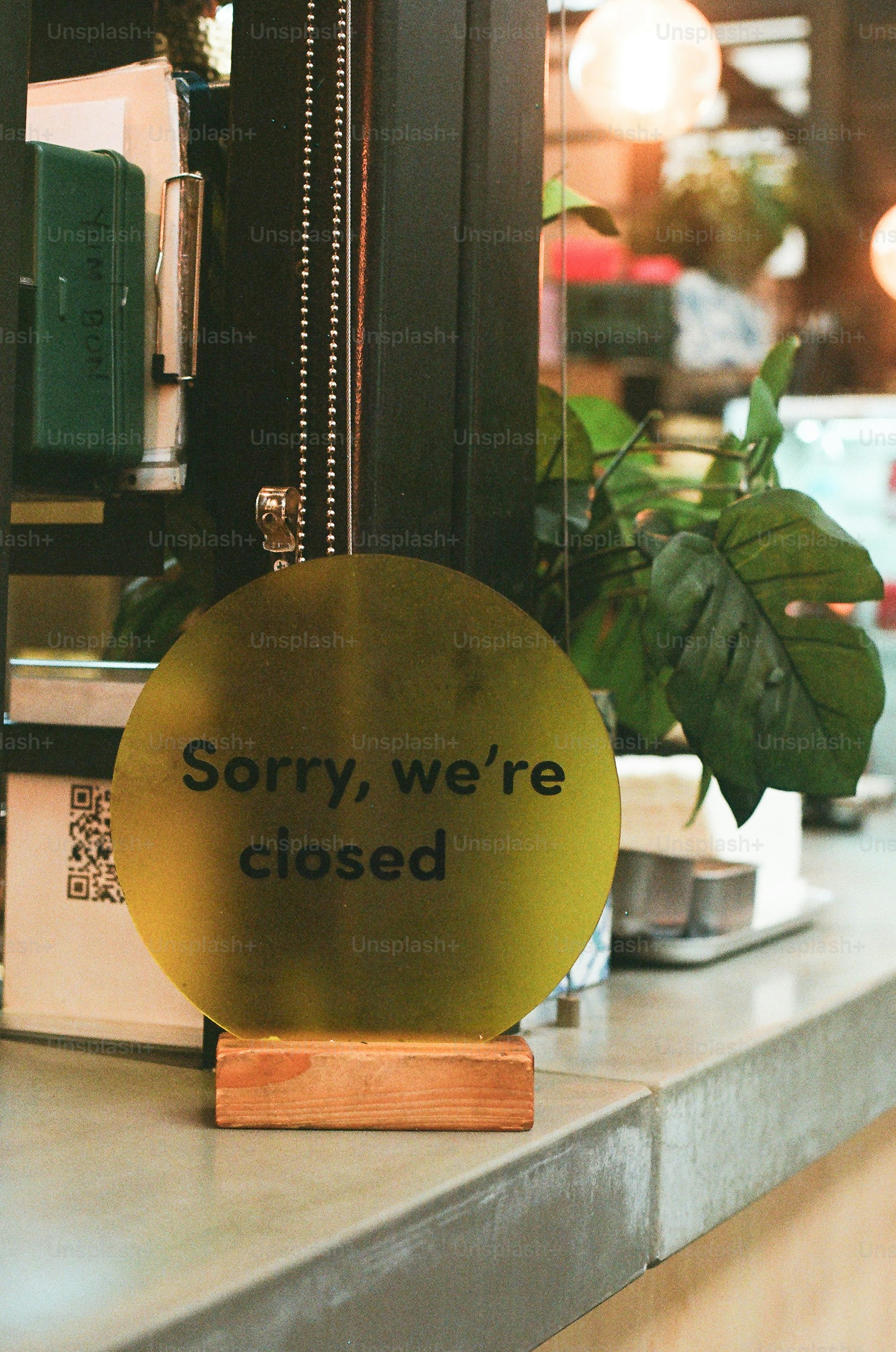 A 'sorry, we're closed' sign on a counter.