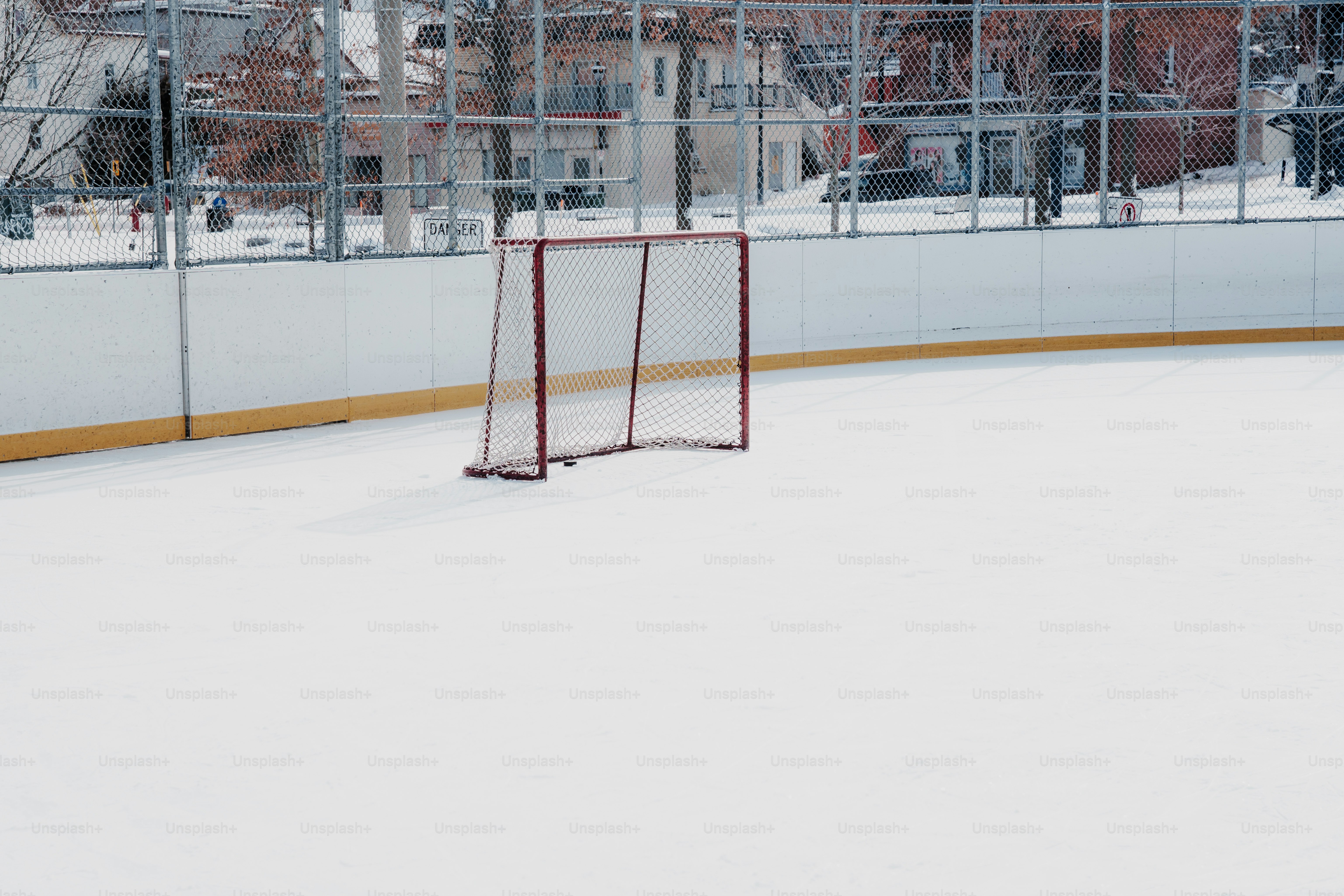 Empty hockey net on a snowy ice rink photo – Hockey Image on Unsplash