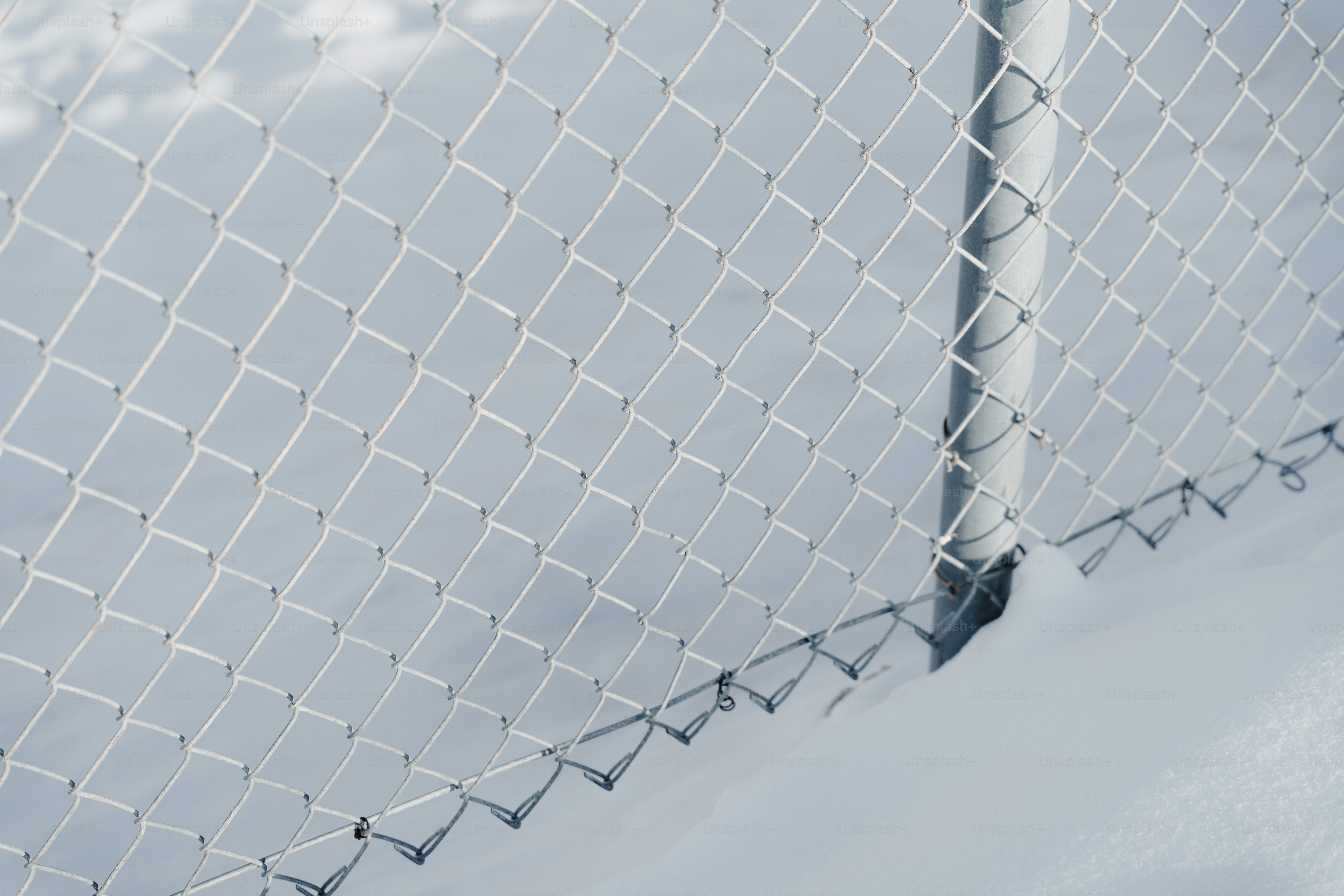A chain-link fence covered in snow photo – Background Image on Unsplash