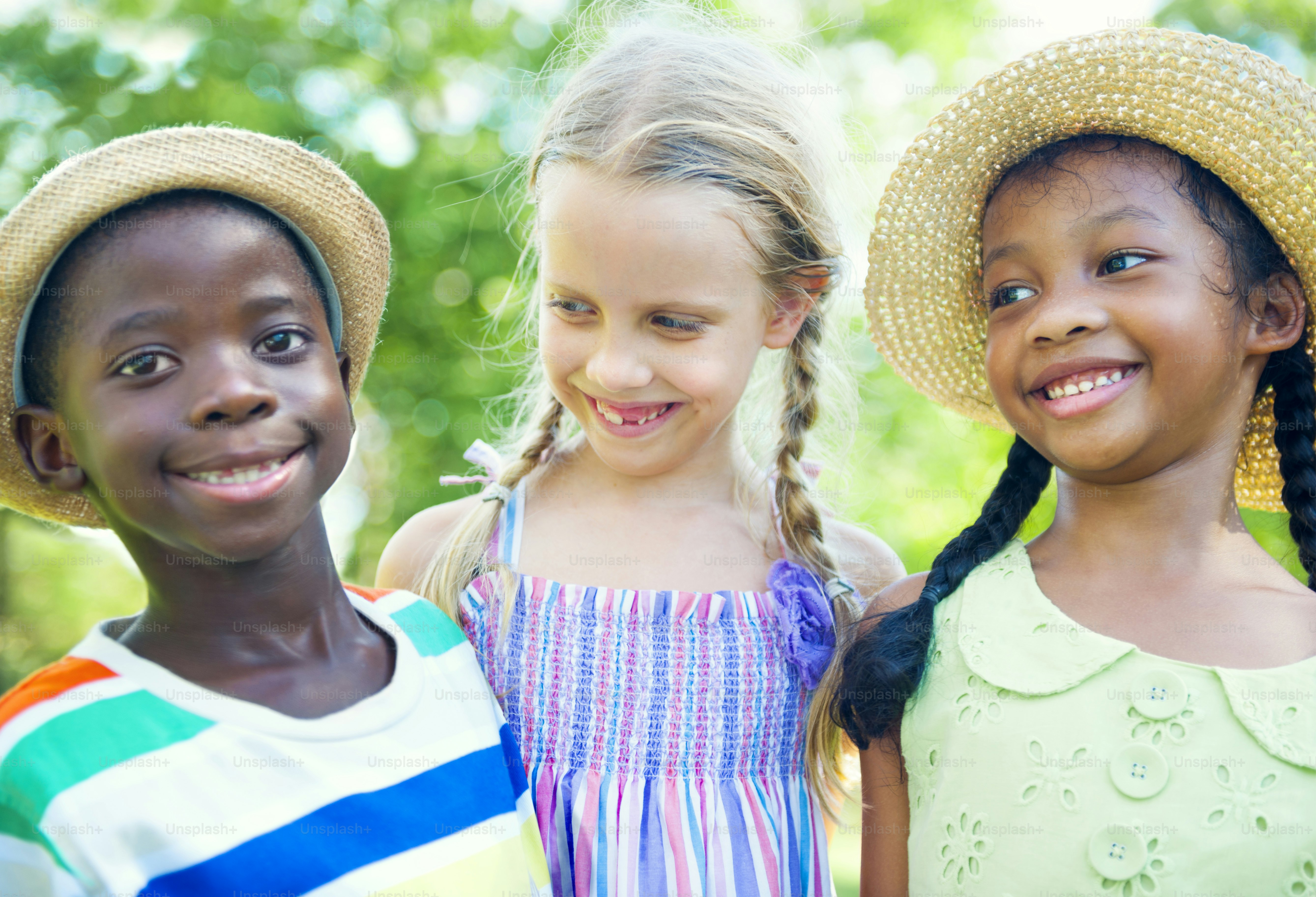A diverse group of children wearing colorful superhero t-shirts photo ...