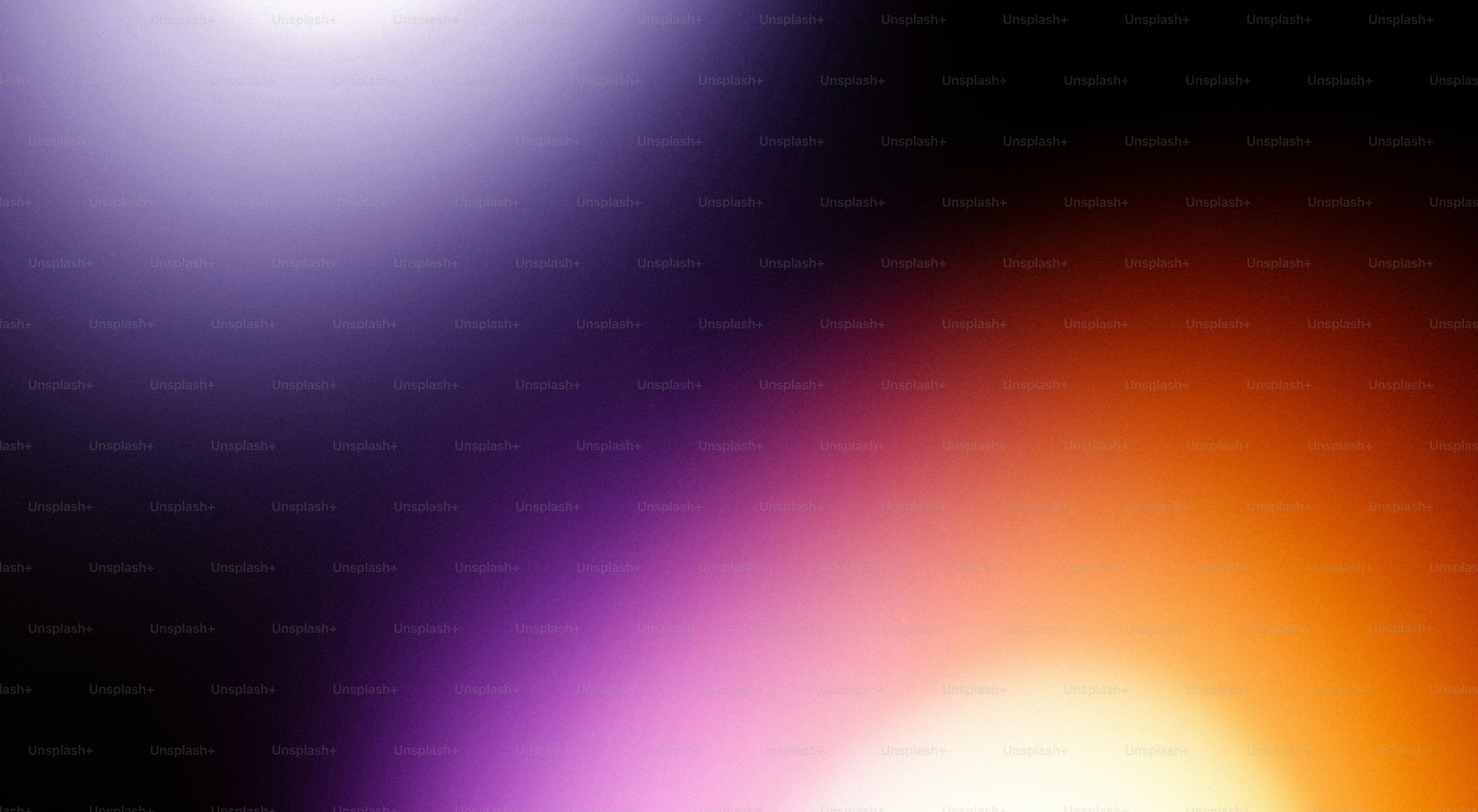 Abstract blend of purple and orange light flares.