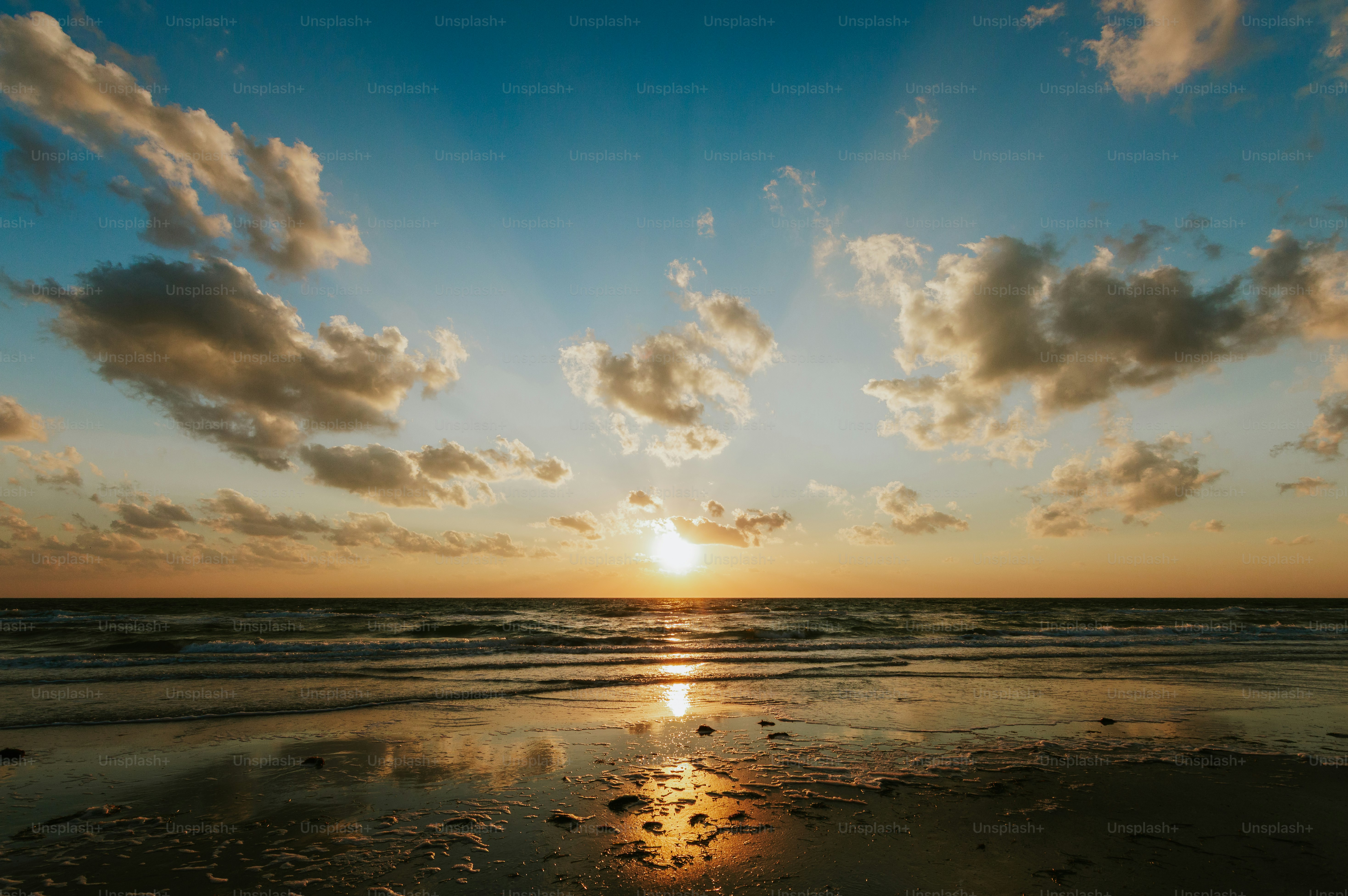 Sunset over the ocean with dramatic clouds
