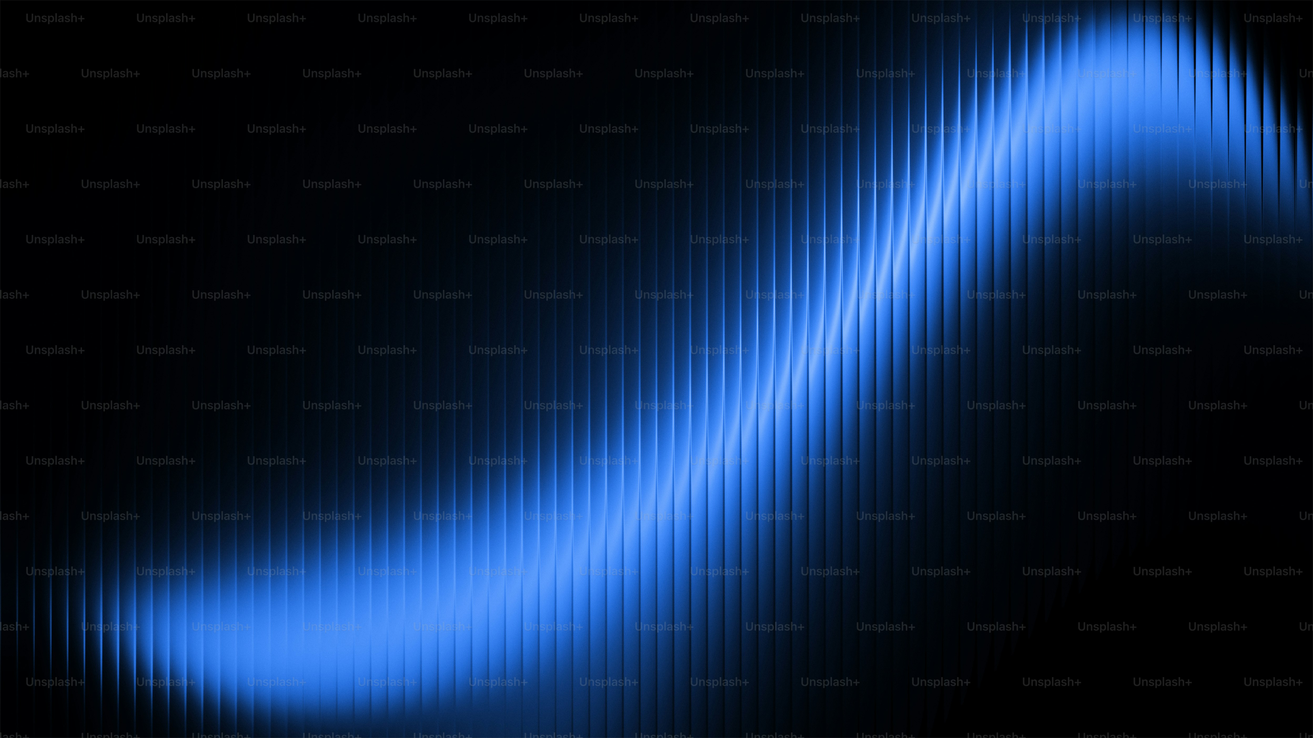 A glowing blue wave against a dark background photo – Background Image ...