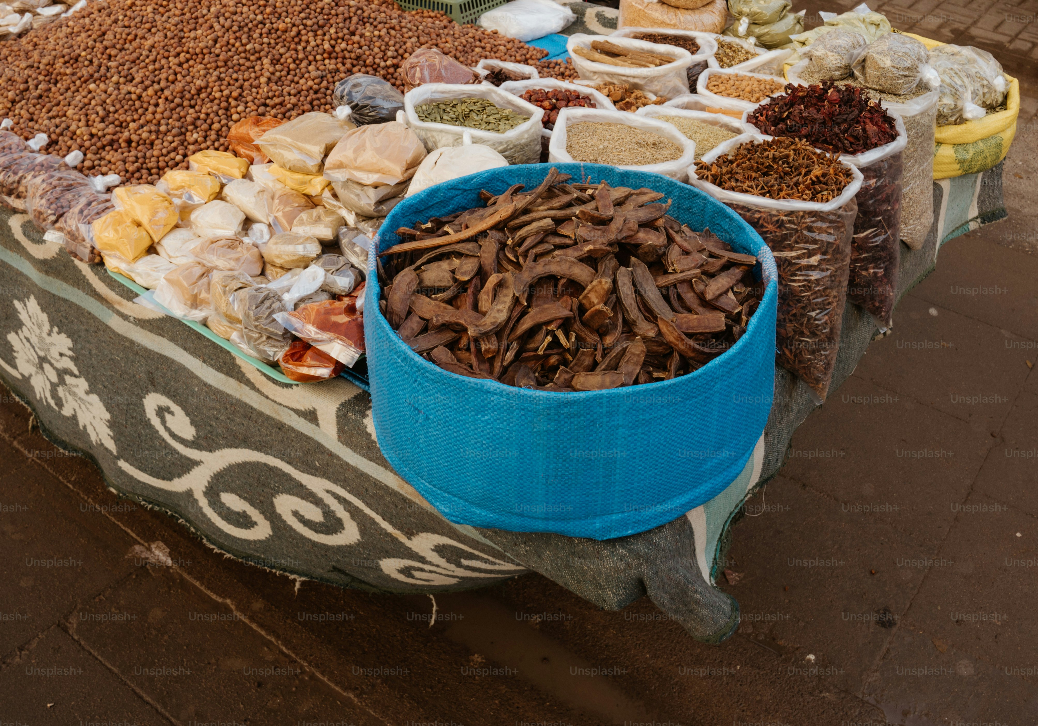 Spices and dried goods displayed at a market stall.