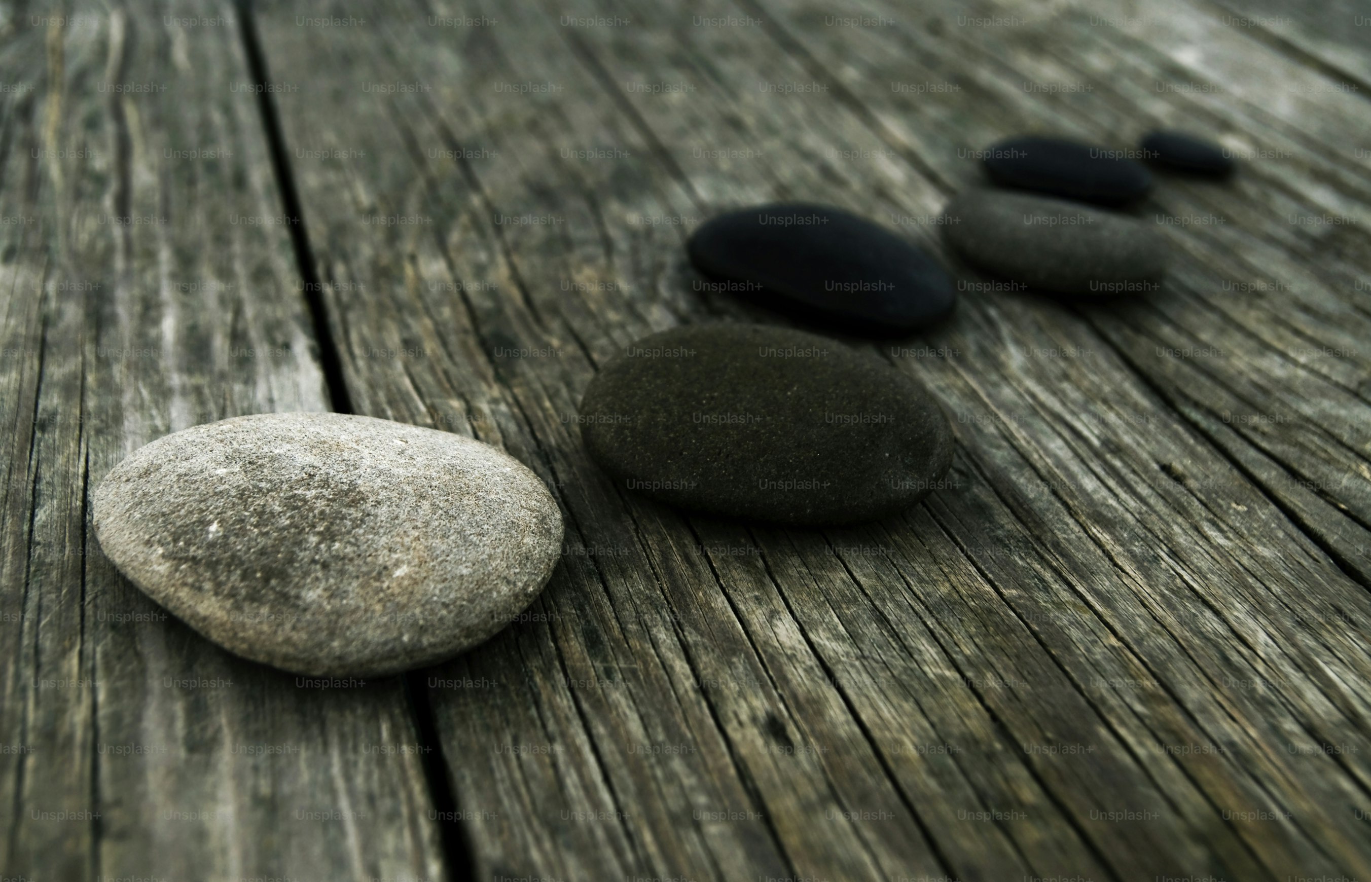 Smooth pebbles on an old wooden pier.Related Zen-like images: