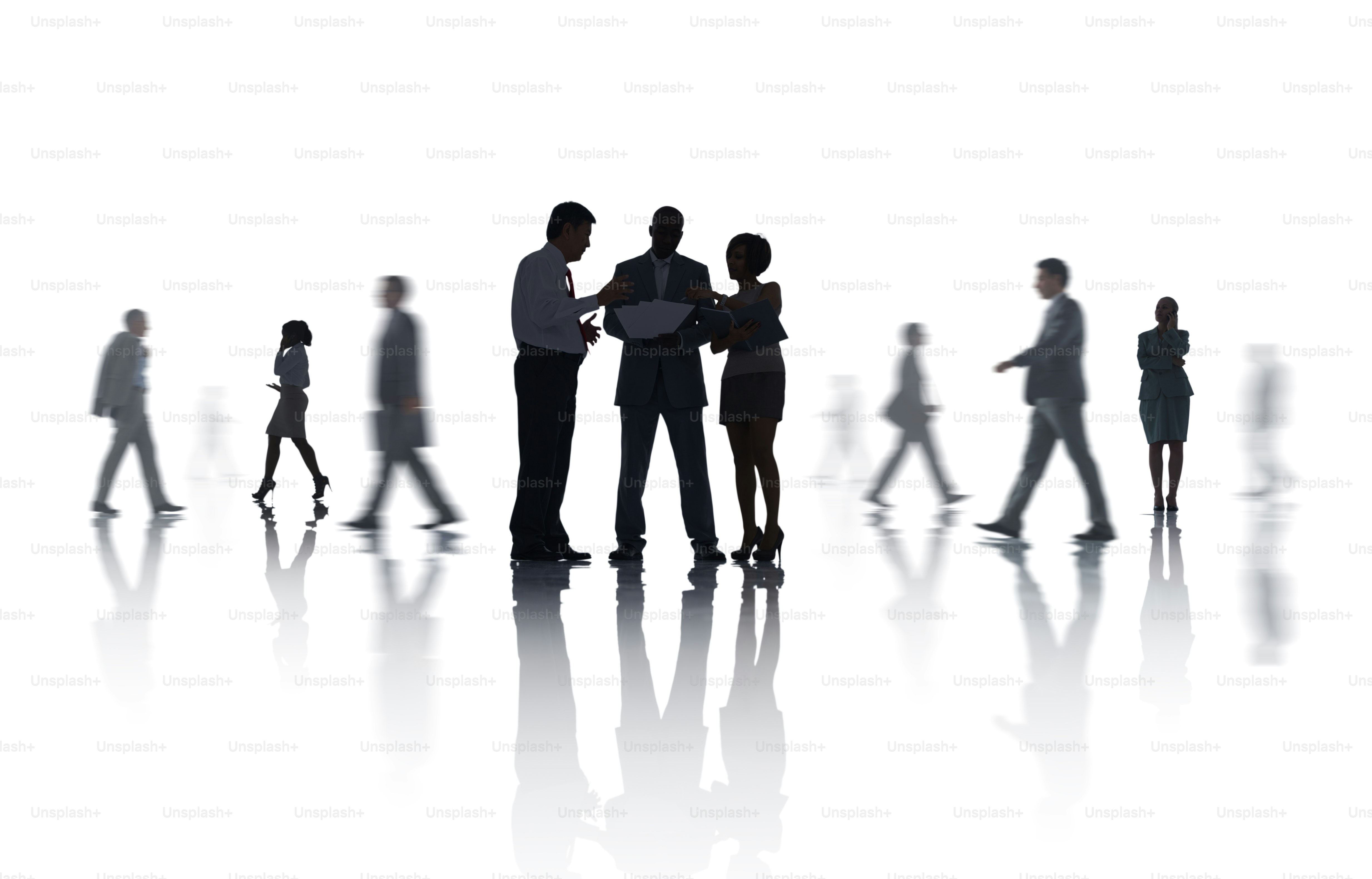 Silhouettes of business people interacting and walking