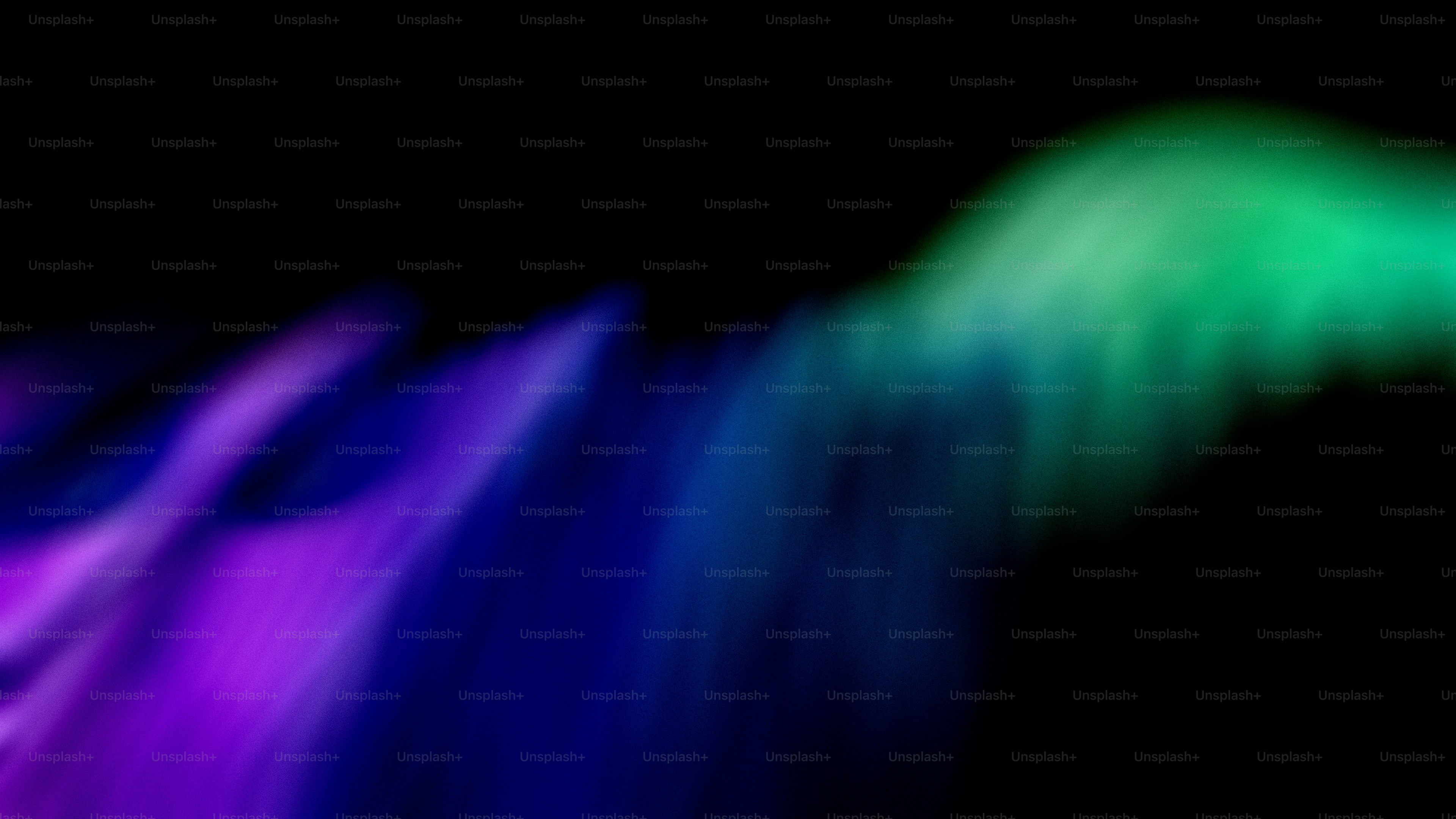 Abstract colorful light streaks on black background