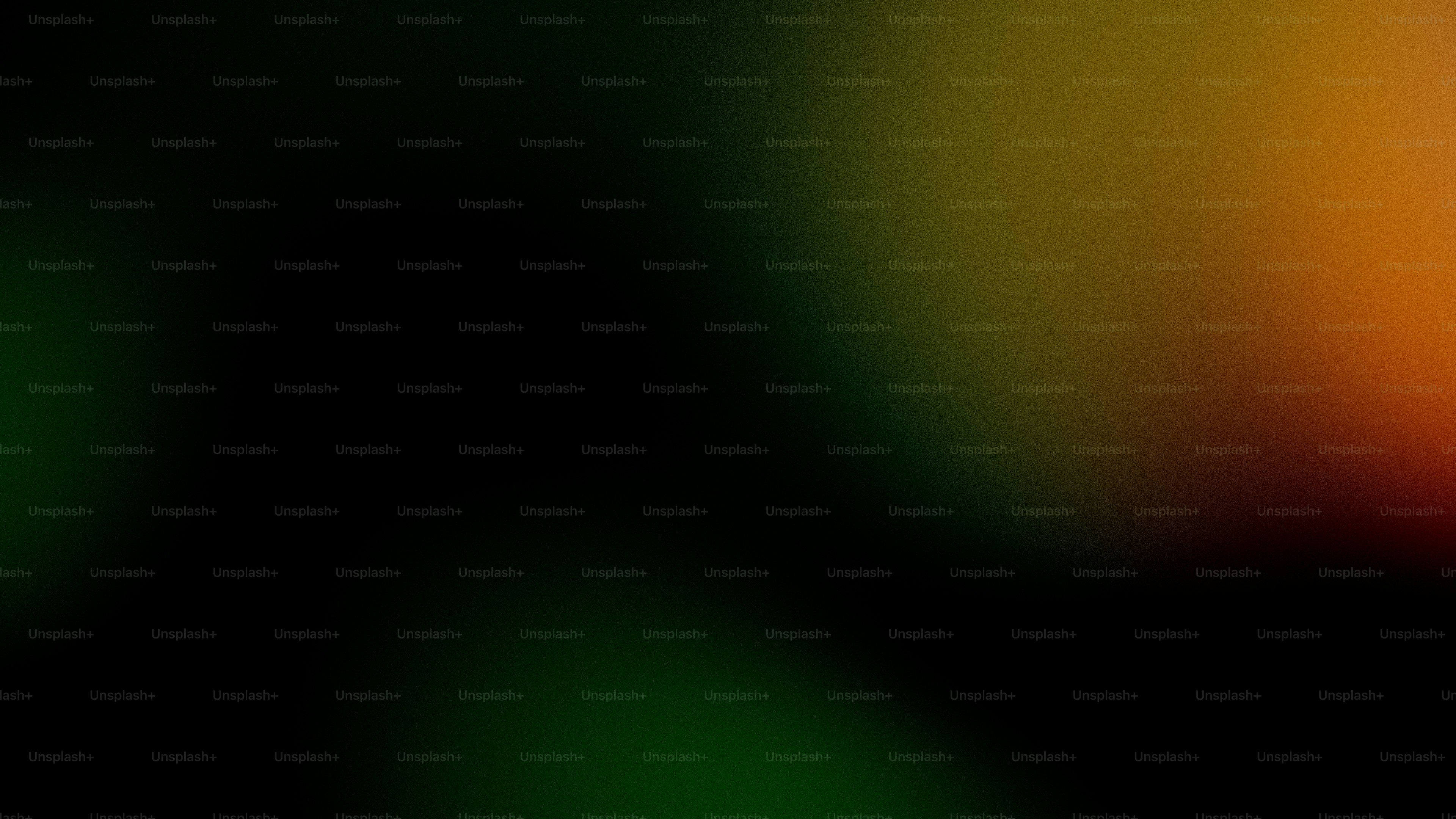 Abstract gradient of black, green, and orange colors.