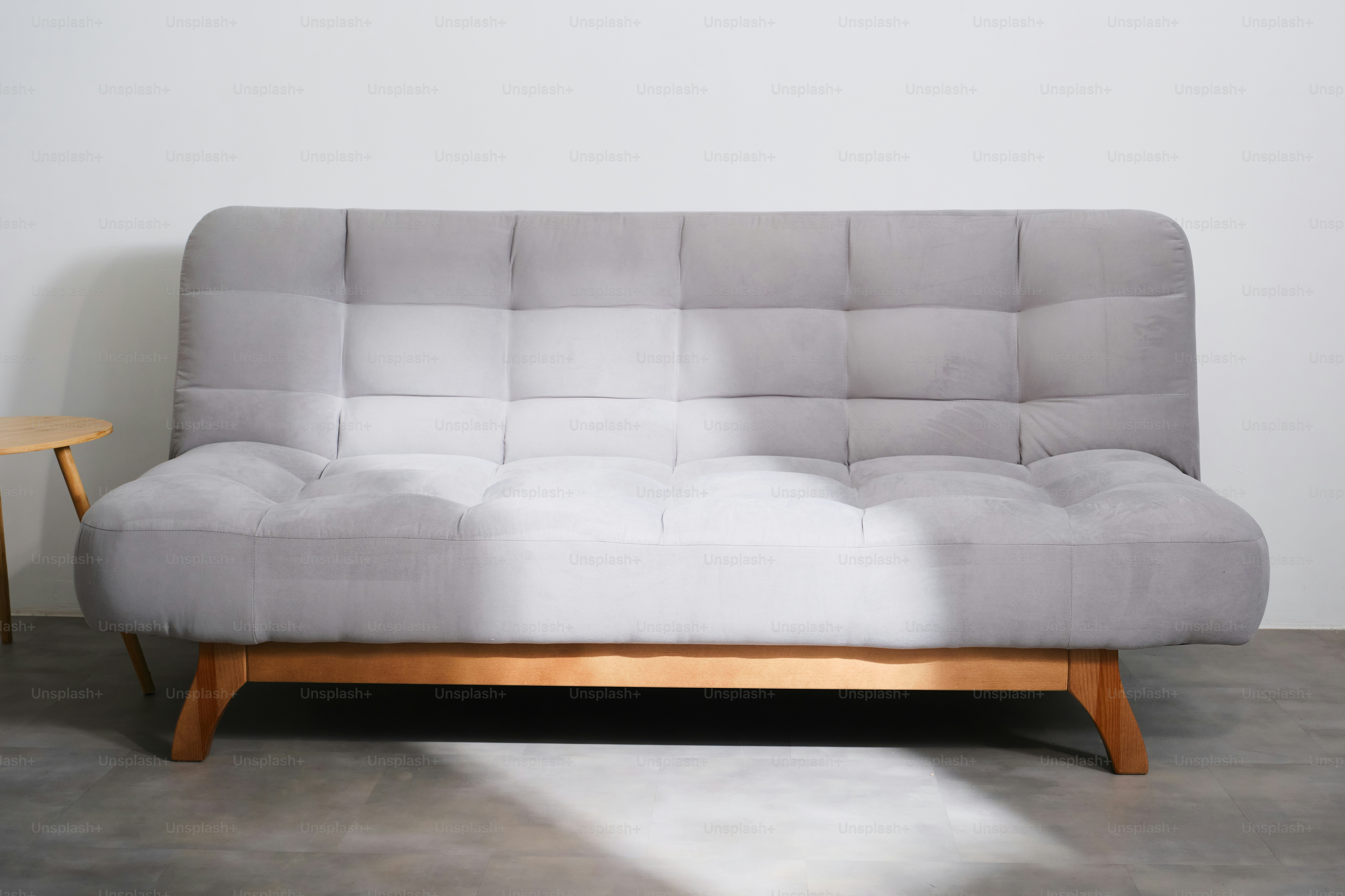 Minimal single furniture pieces photographed on neutral backgrounds