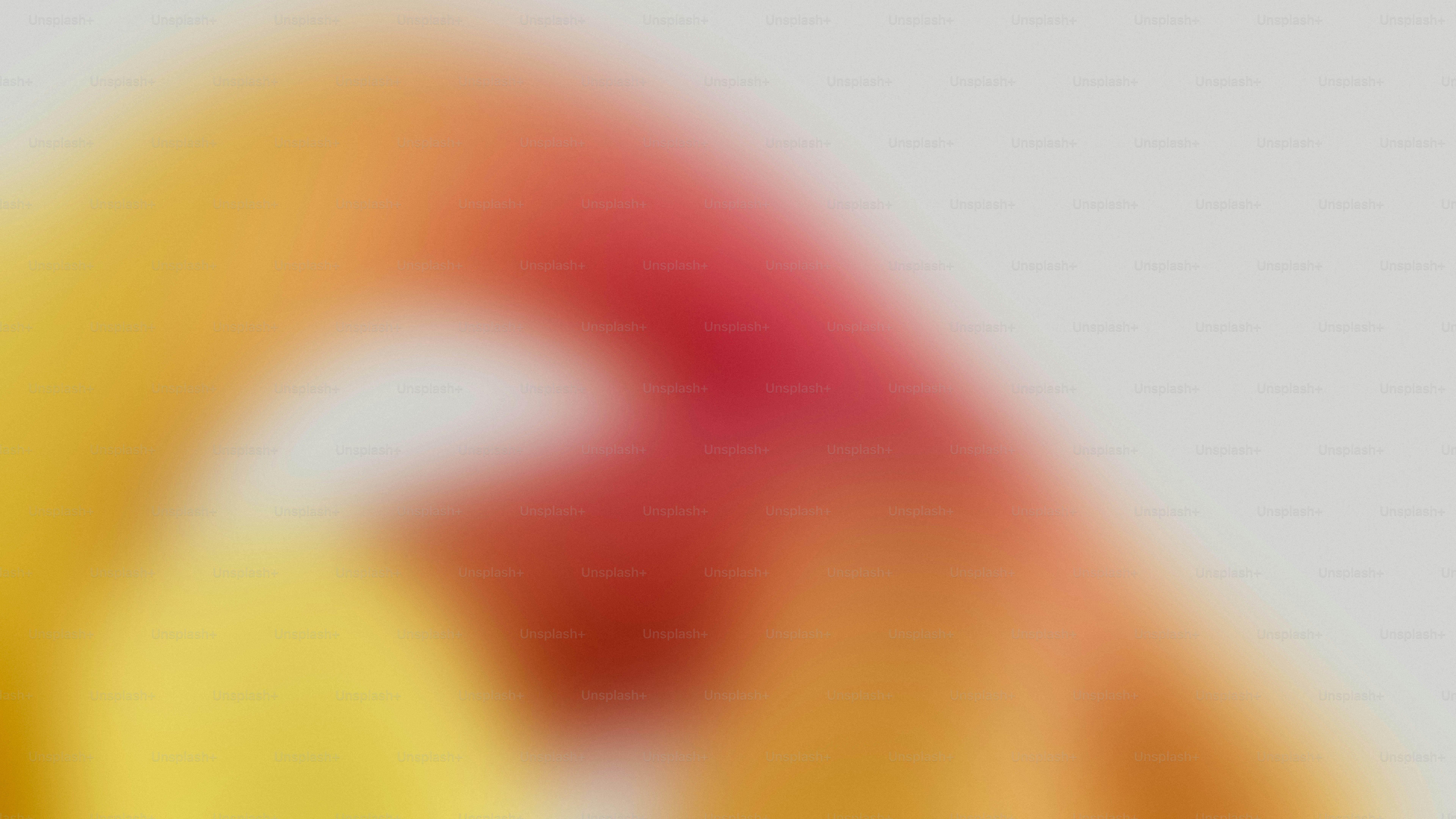 Abstract blend of yellow, red, and white colors