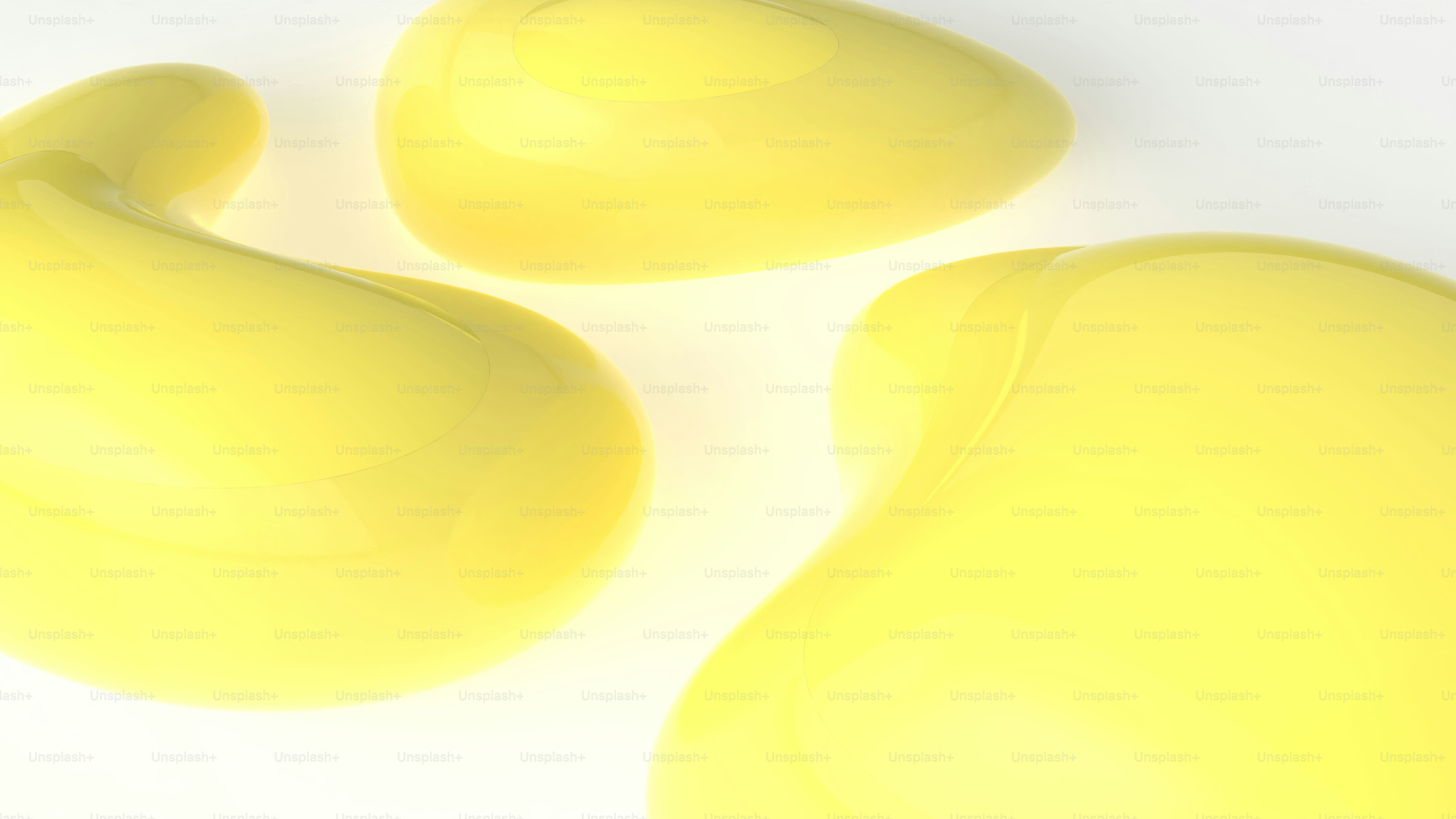 Three abstract yellow blobs on a white background