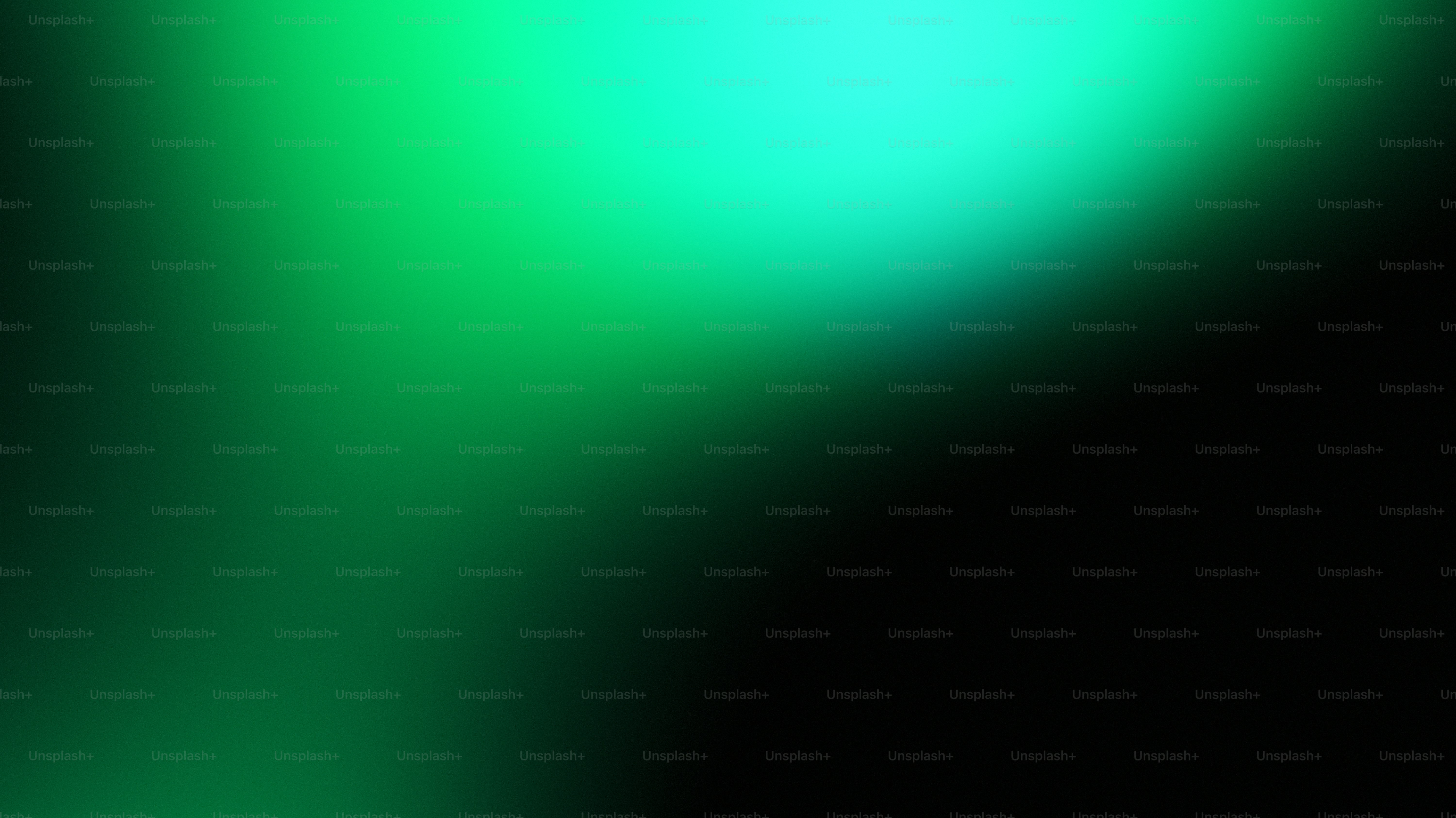 Un degradado de luz verde sobre fondo negro