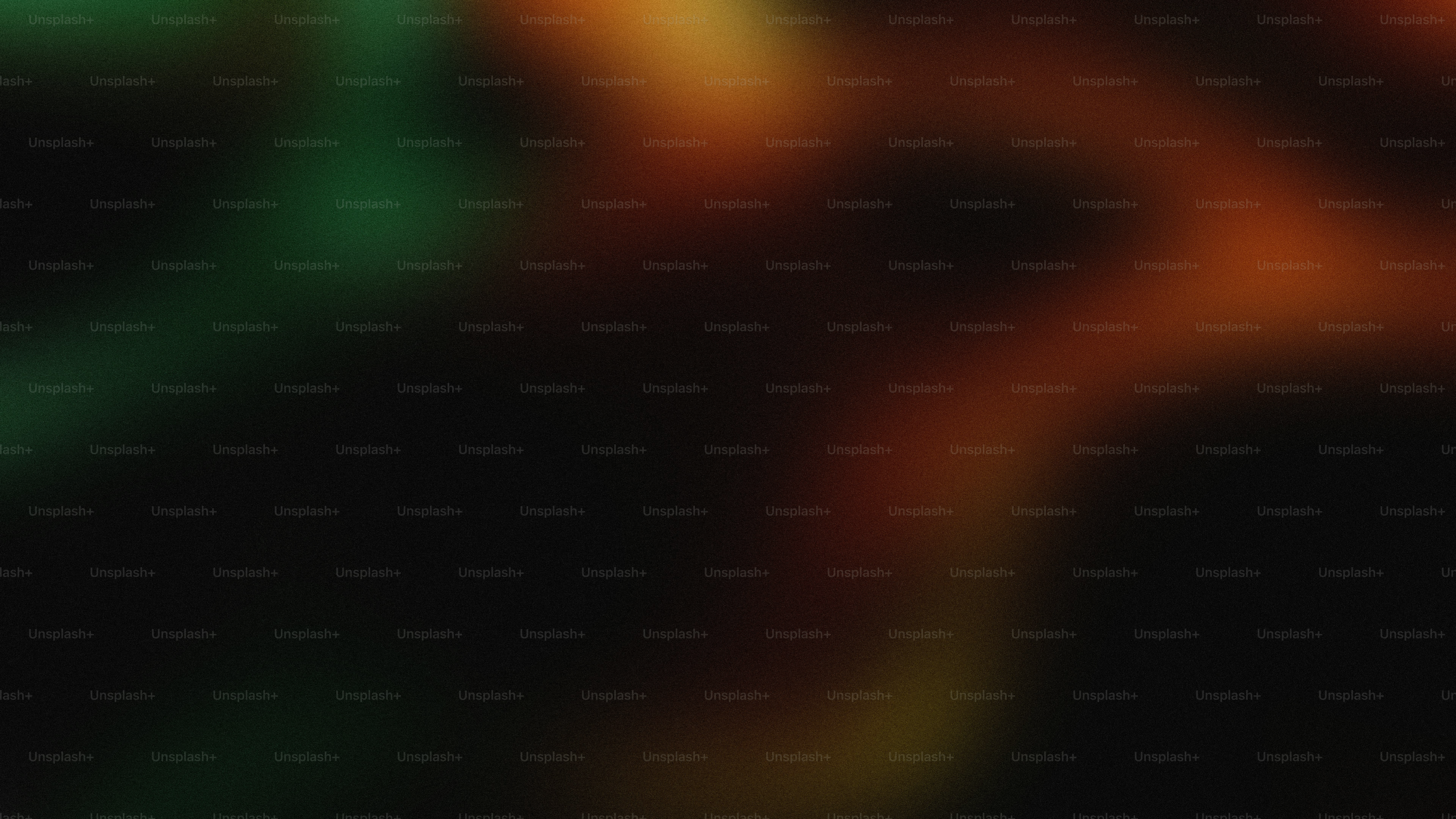 Fond sombre flou abstrait avec des lumières vertes et orange