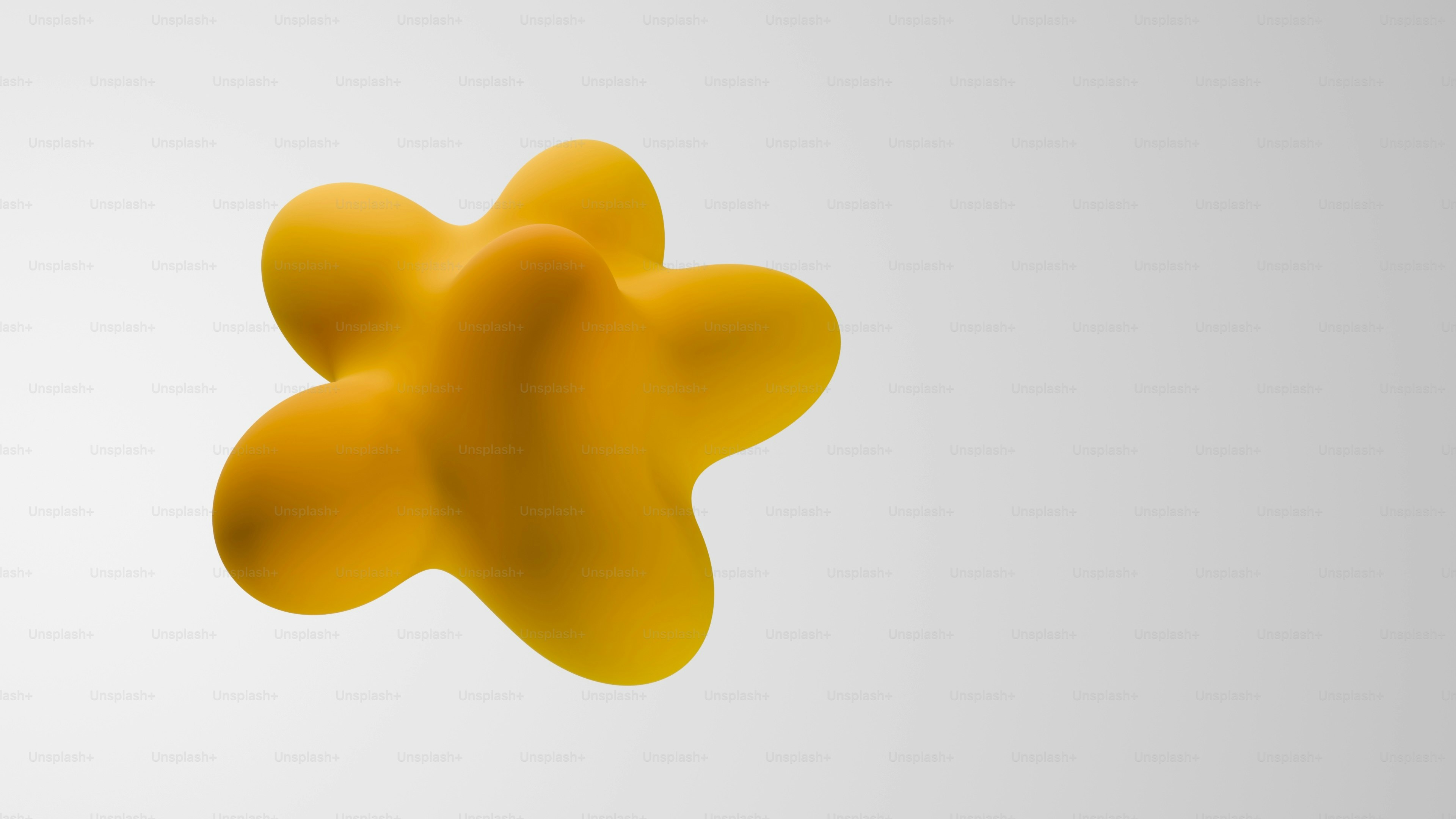 Yellow amorphous blob floats against white background