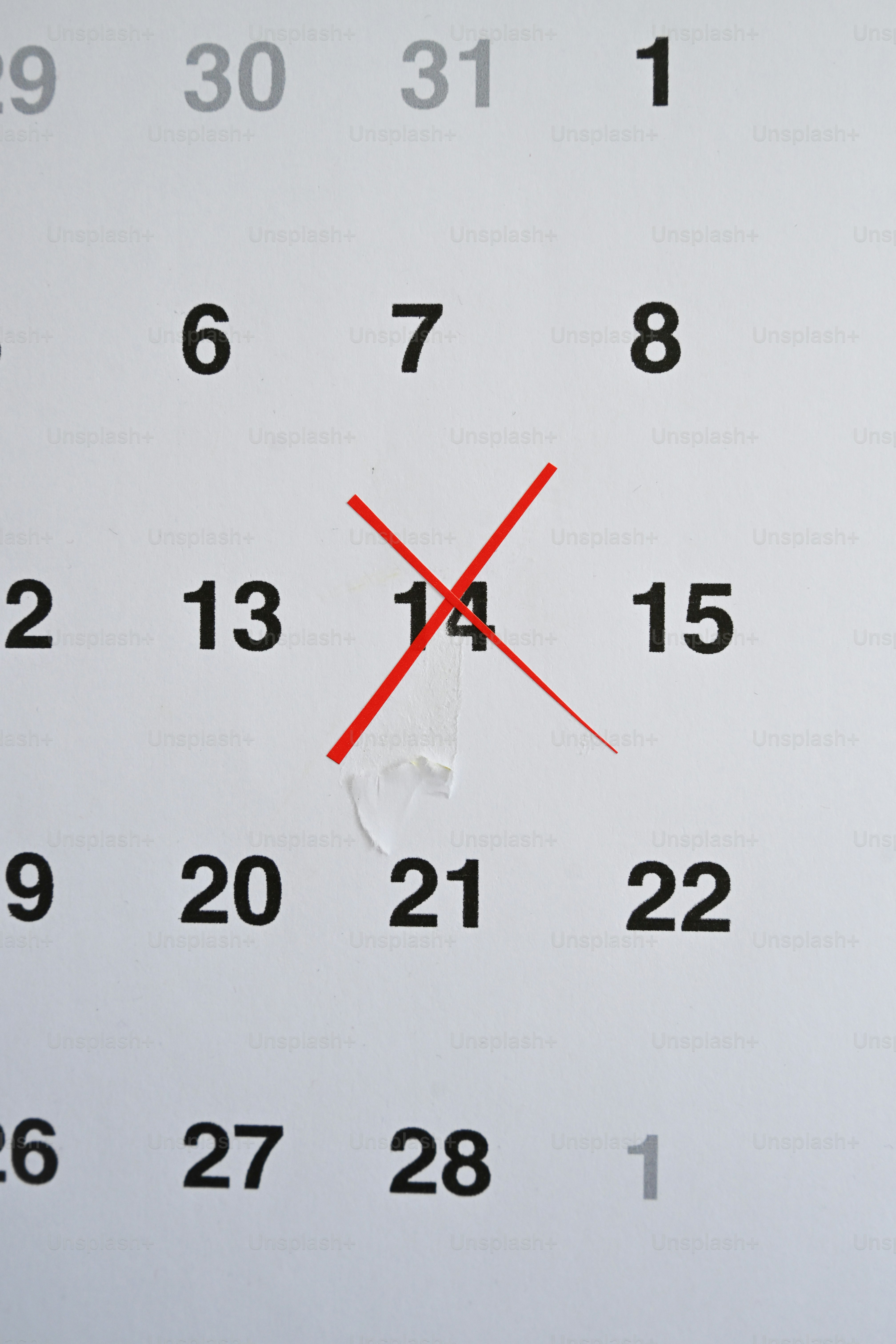 A calendar page with the 14th marked with an x.
