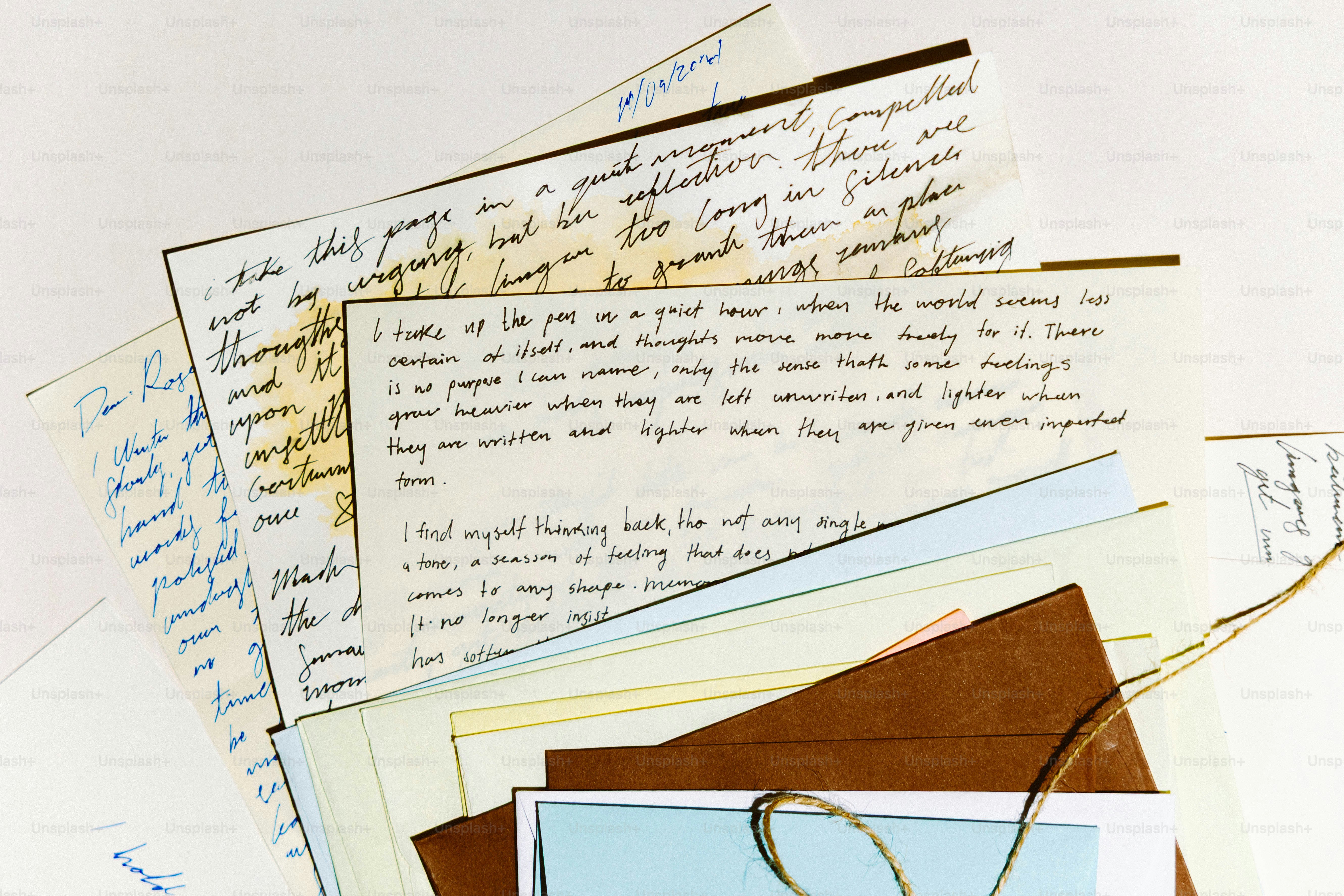 Stack of old handwritten letters and envelopes tied with string