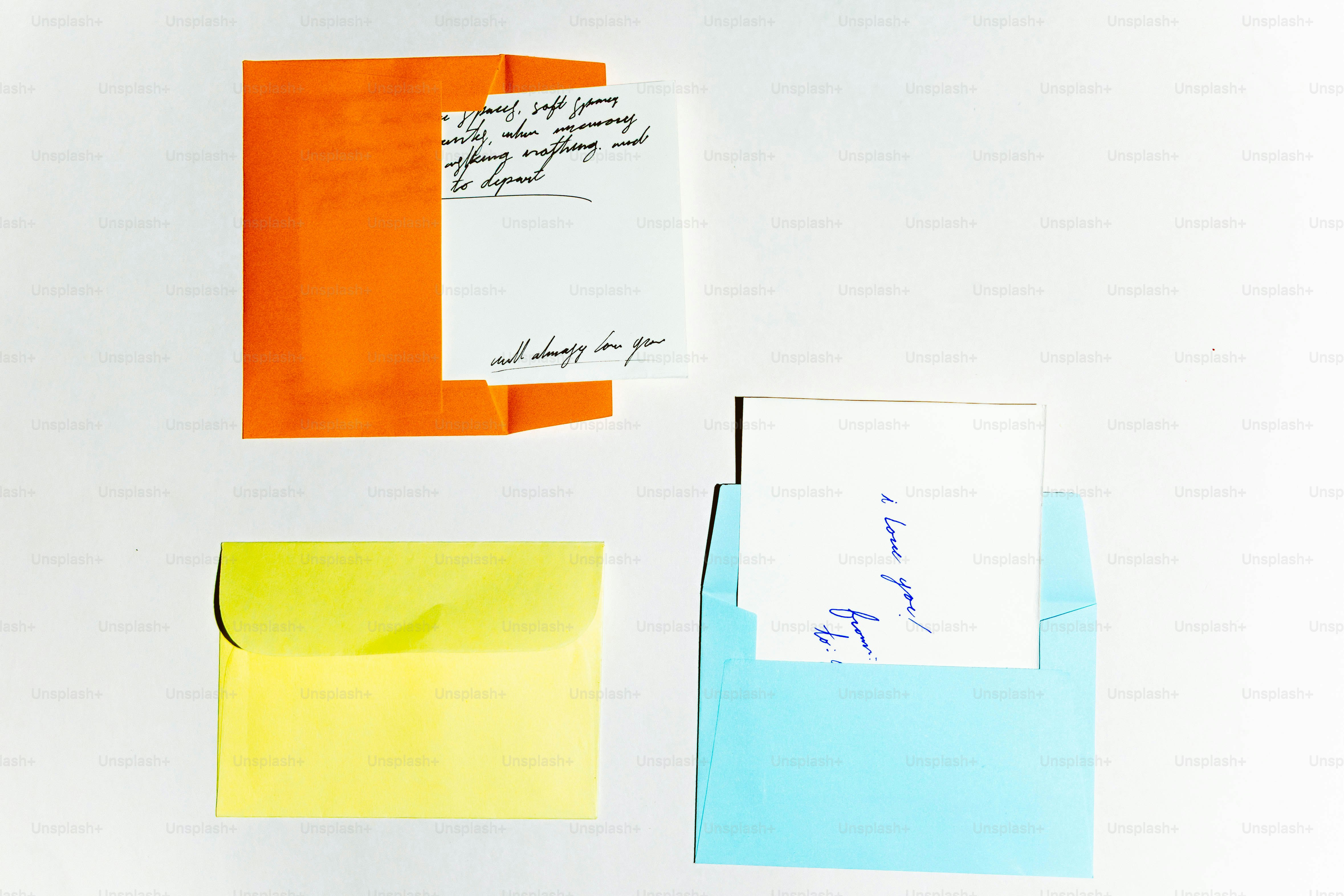 Three colorful envelopes with handwritten notes inside notes inside.